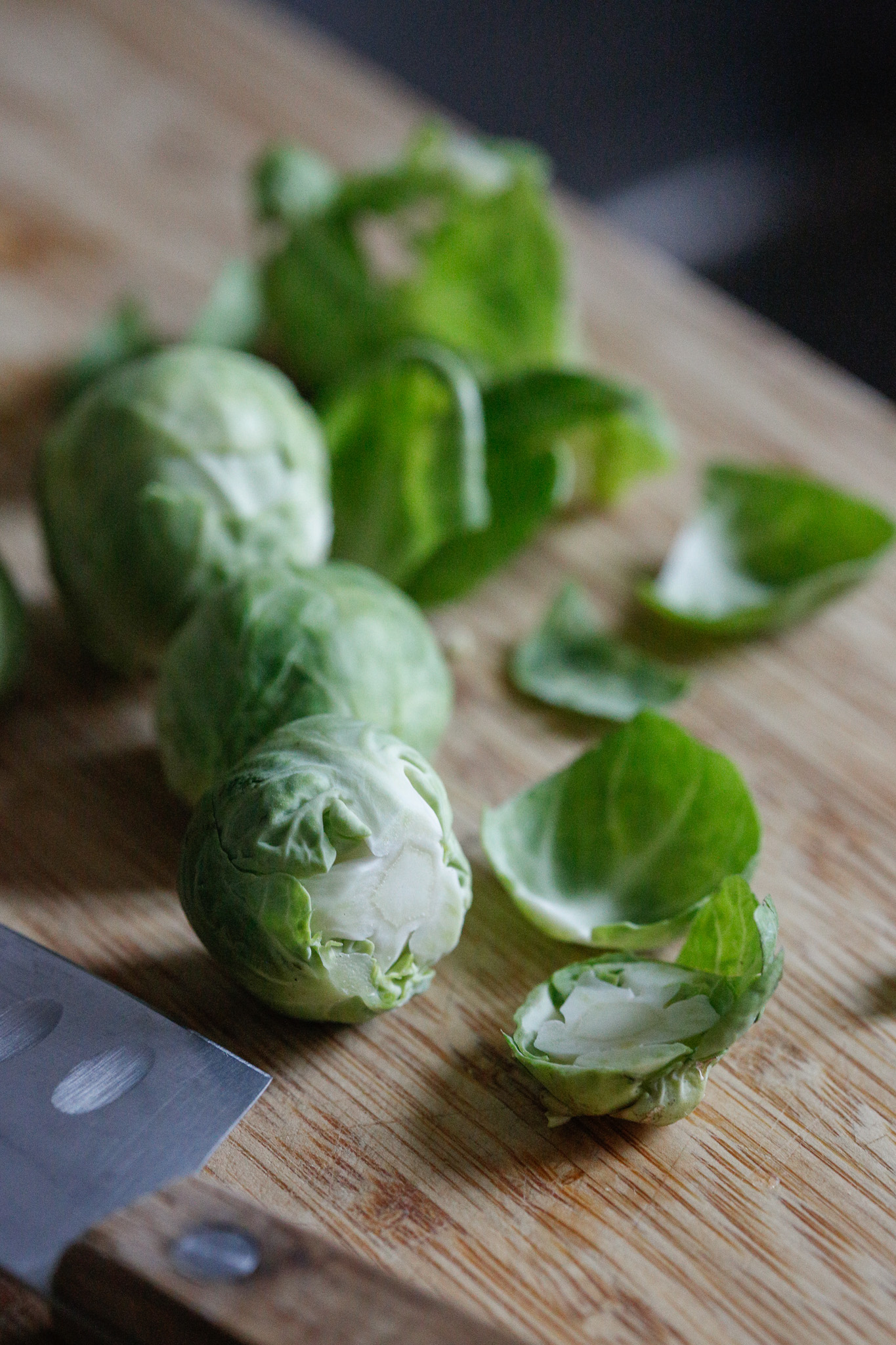 Cut off the bottom root of the sprout. The outer leaves may fall off. Peel off the ones that don't until they are clean