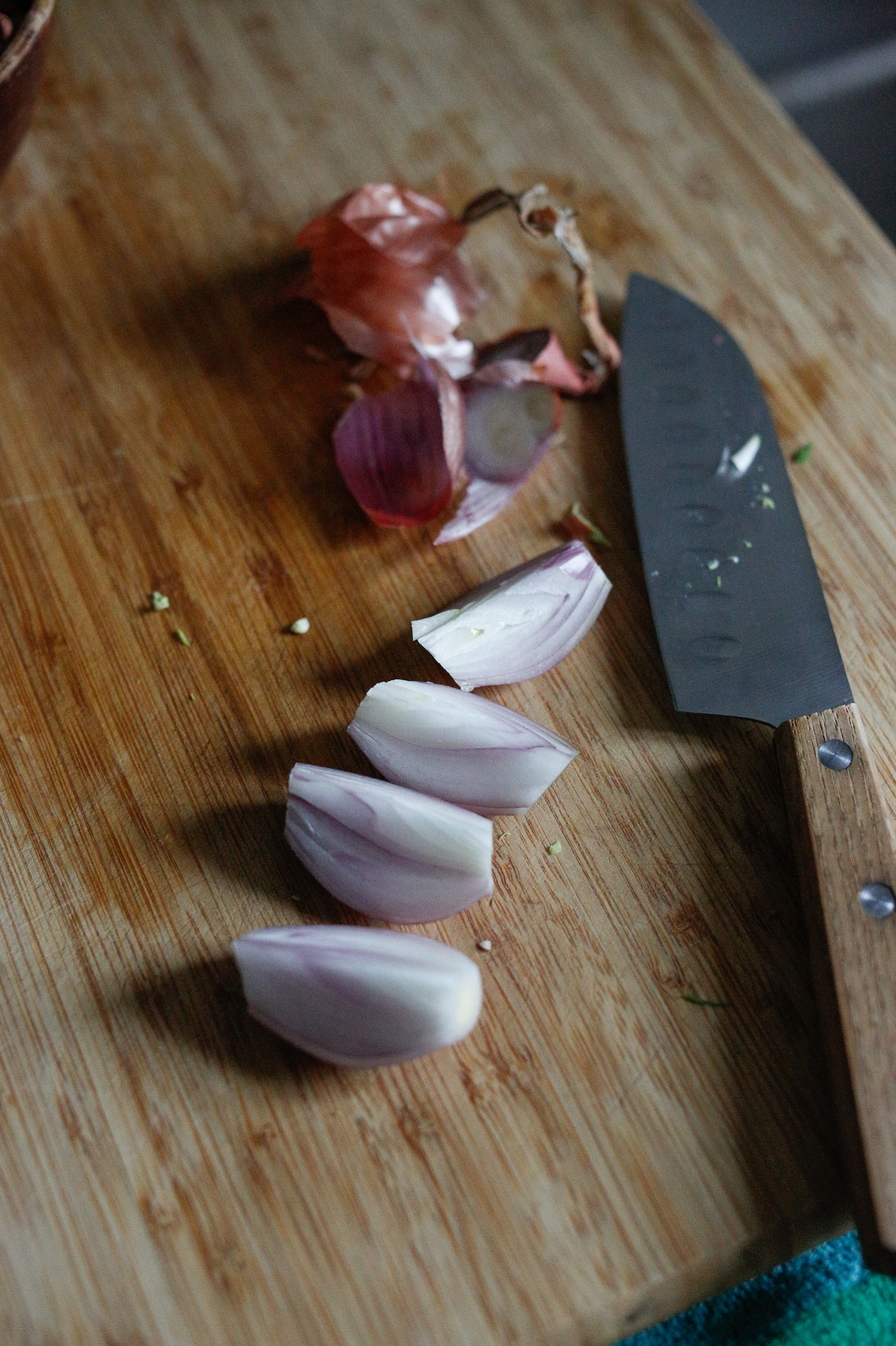 Peel and half or quarter your shallots. Place them directly on your sheet pan