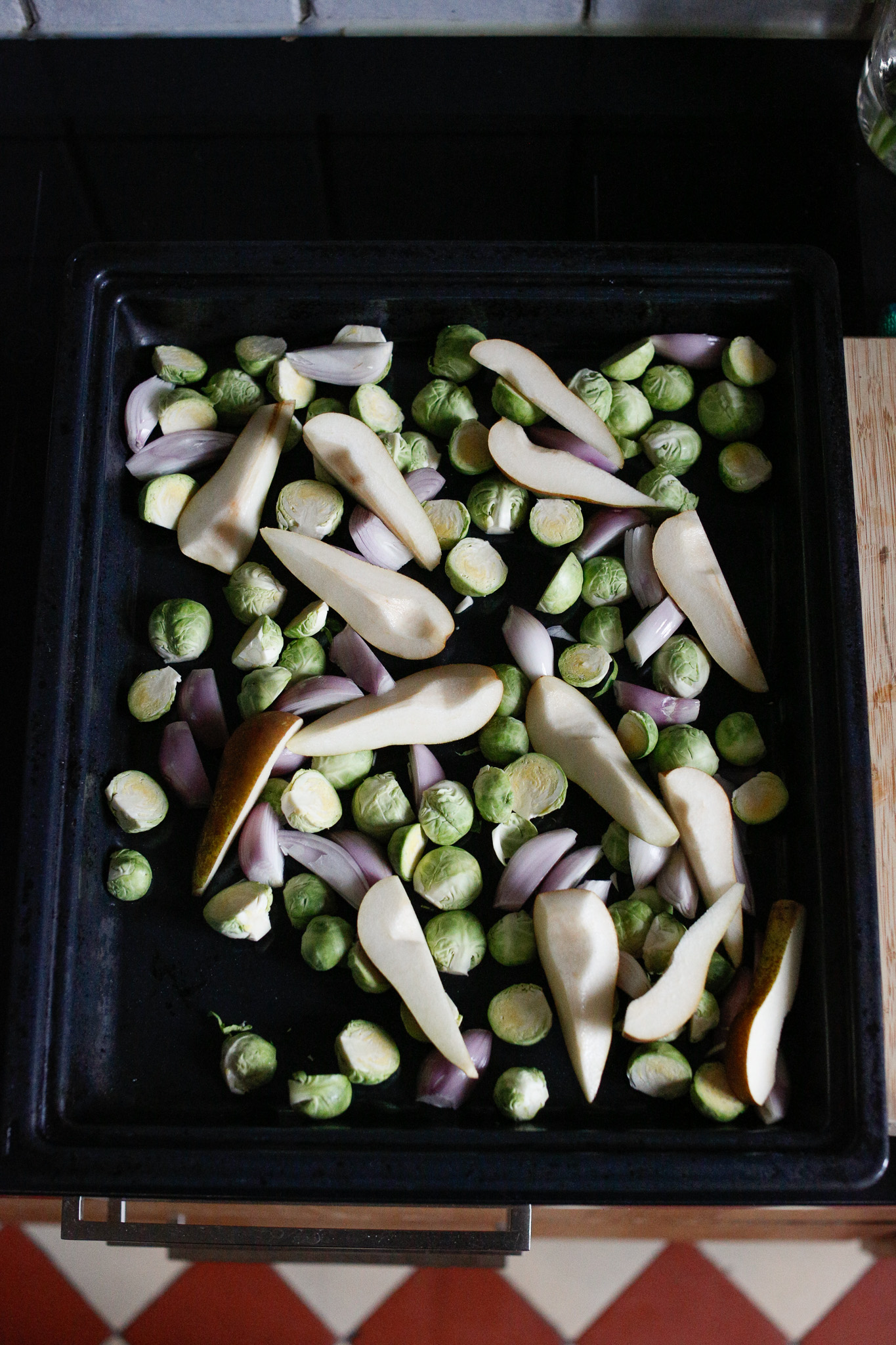 Spread out your brussels sprouts, shallots and pears on your sheet pan