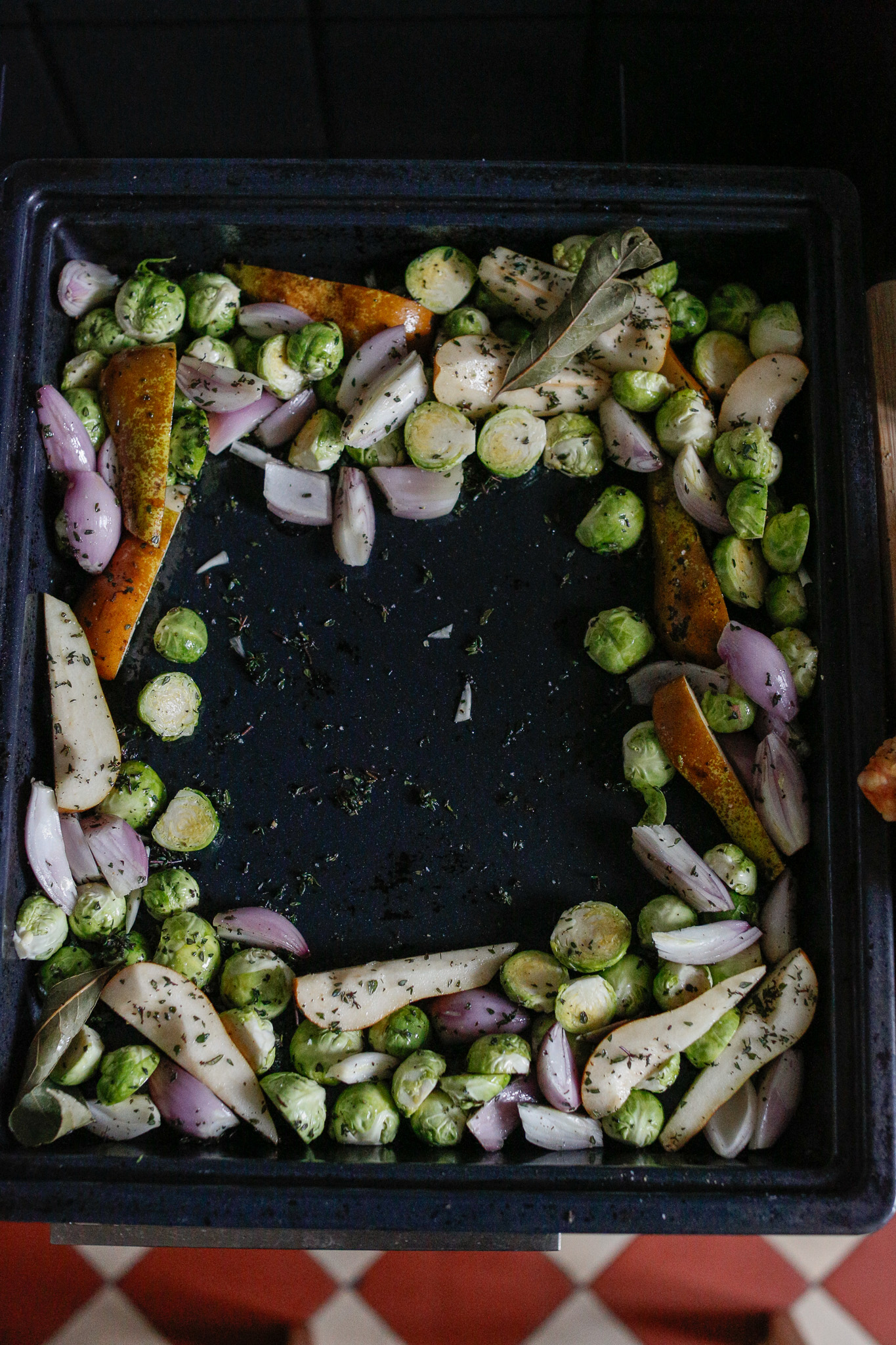 Spread out your goodies to the edge of the pan and make a spot for your chicken