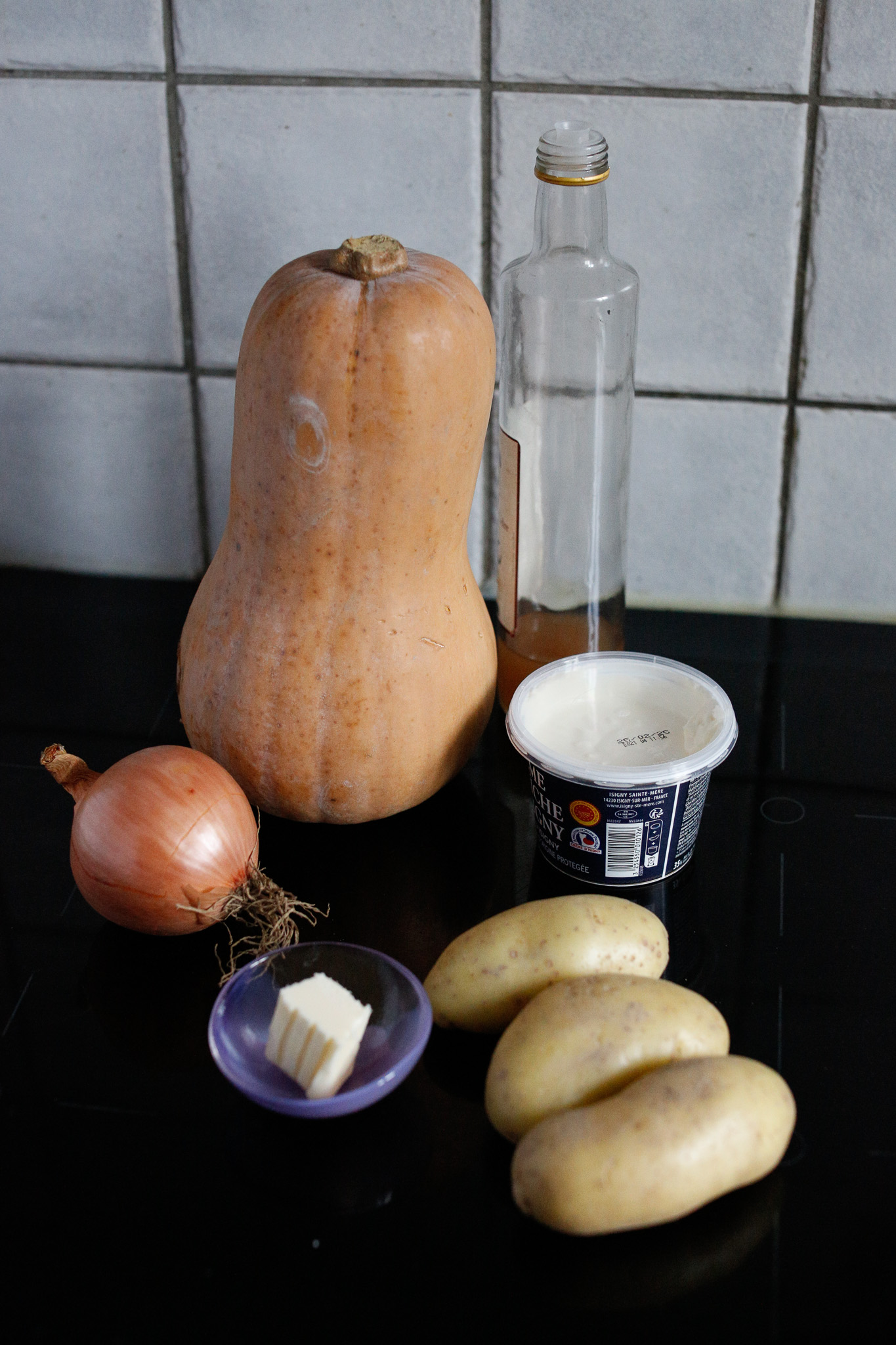 Gather all ingredients. Butternut, potatoes, onion, butter or olive oil, apple cider vinegar and creme fraiche or dairy of choice