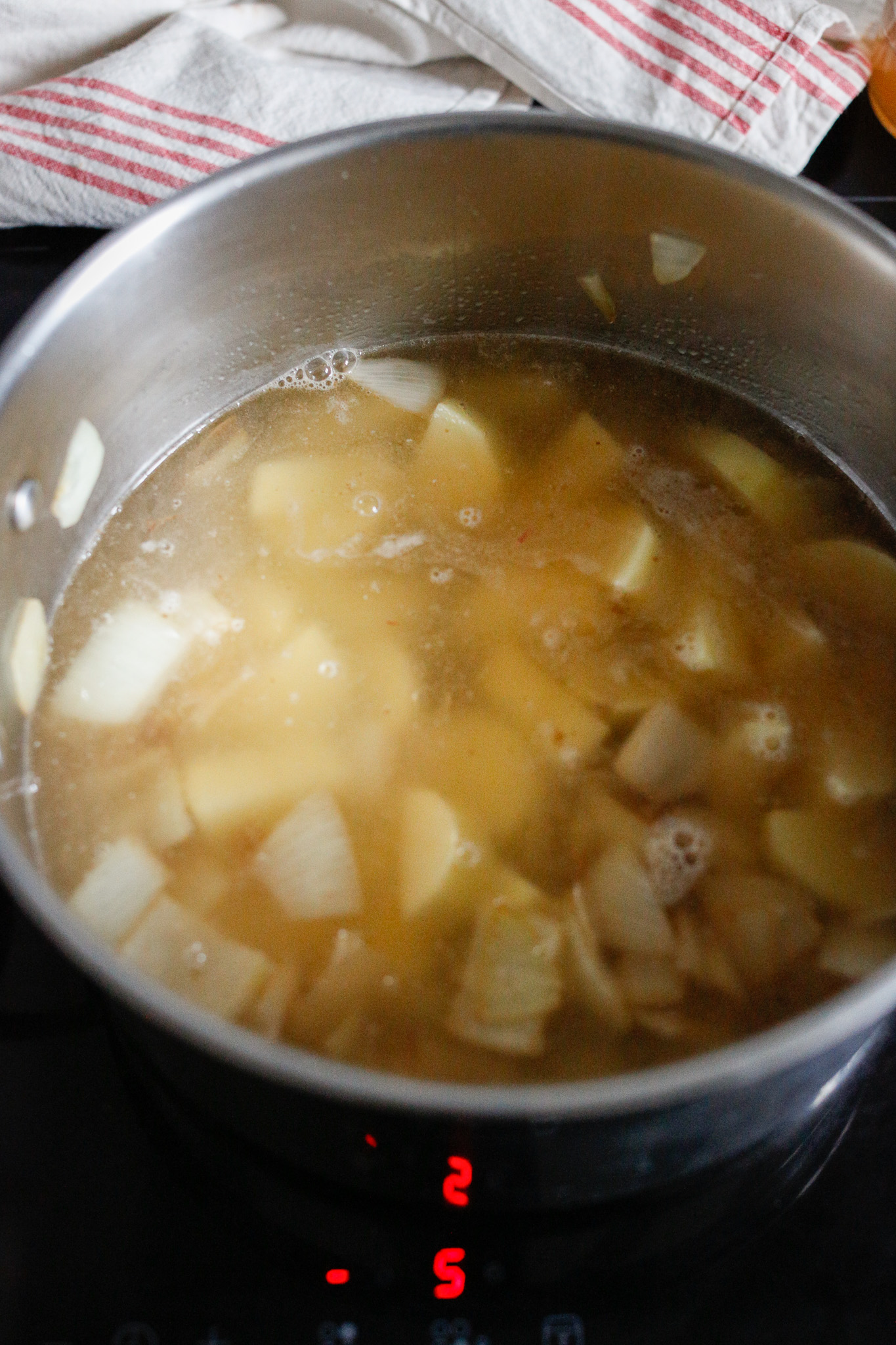 Add in your potatoes and cover with water