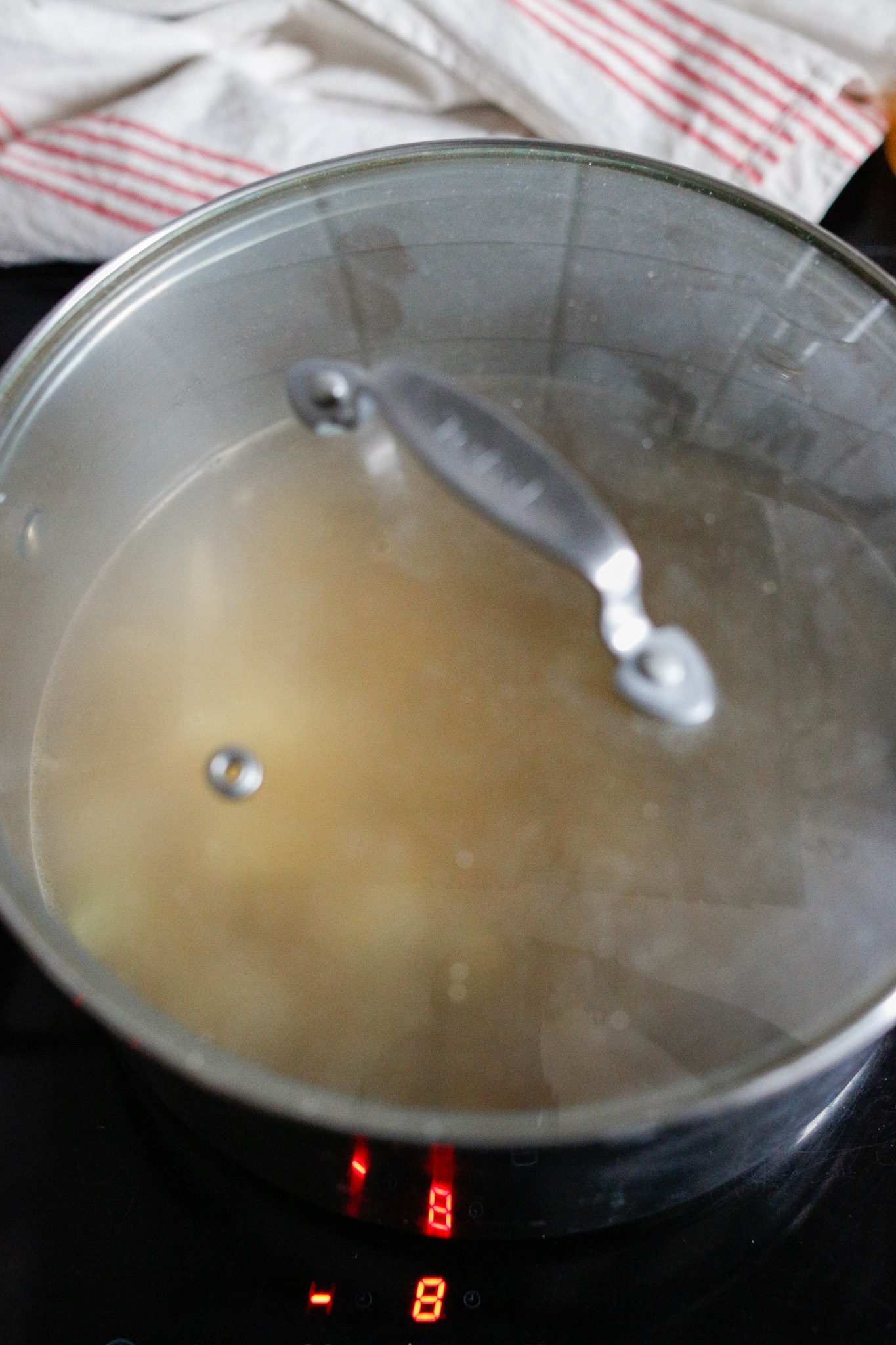 Cover with lid in order to cook them quicker