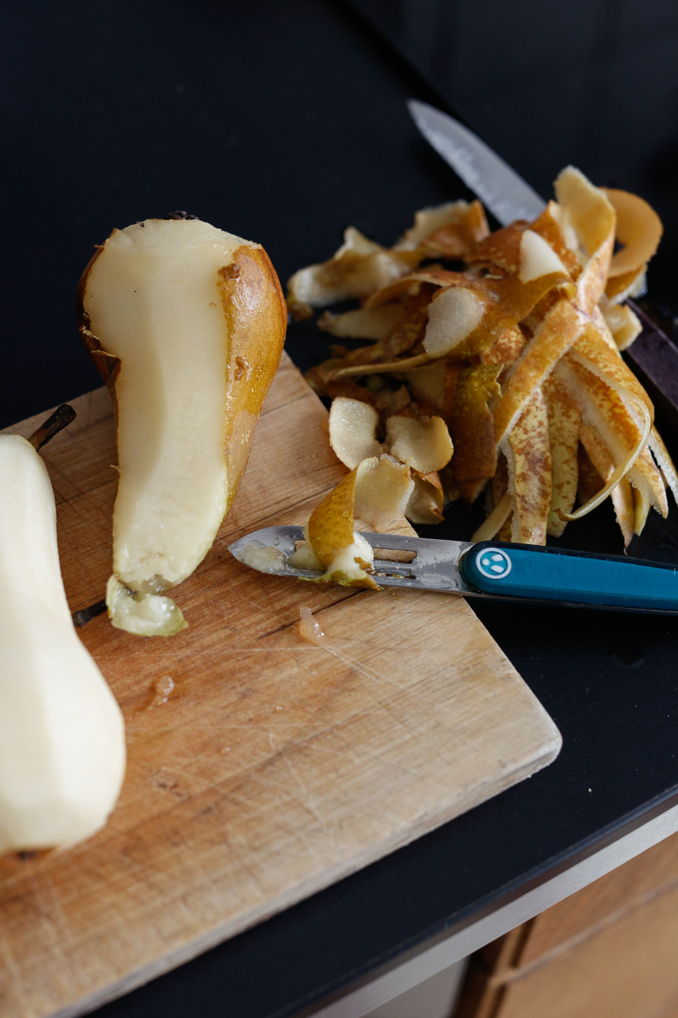 Use a peeler to peel each of your pears
