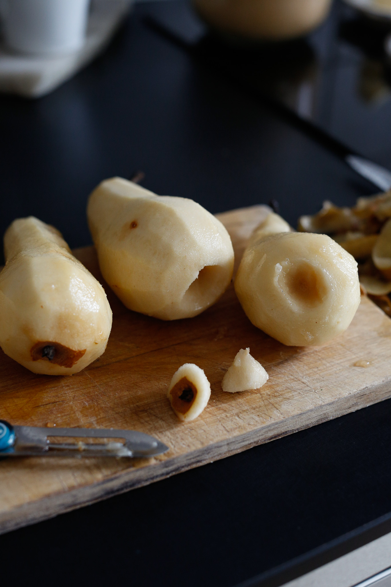 Use tip of peeler to core the bottom of the pear
