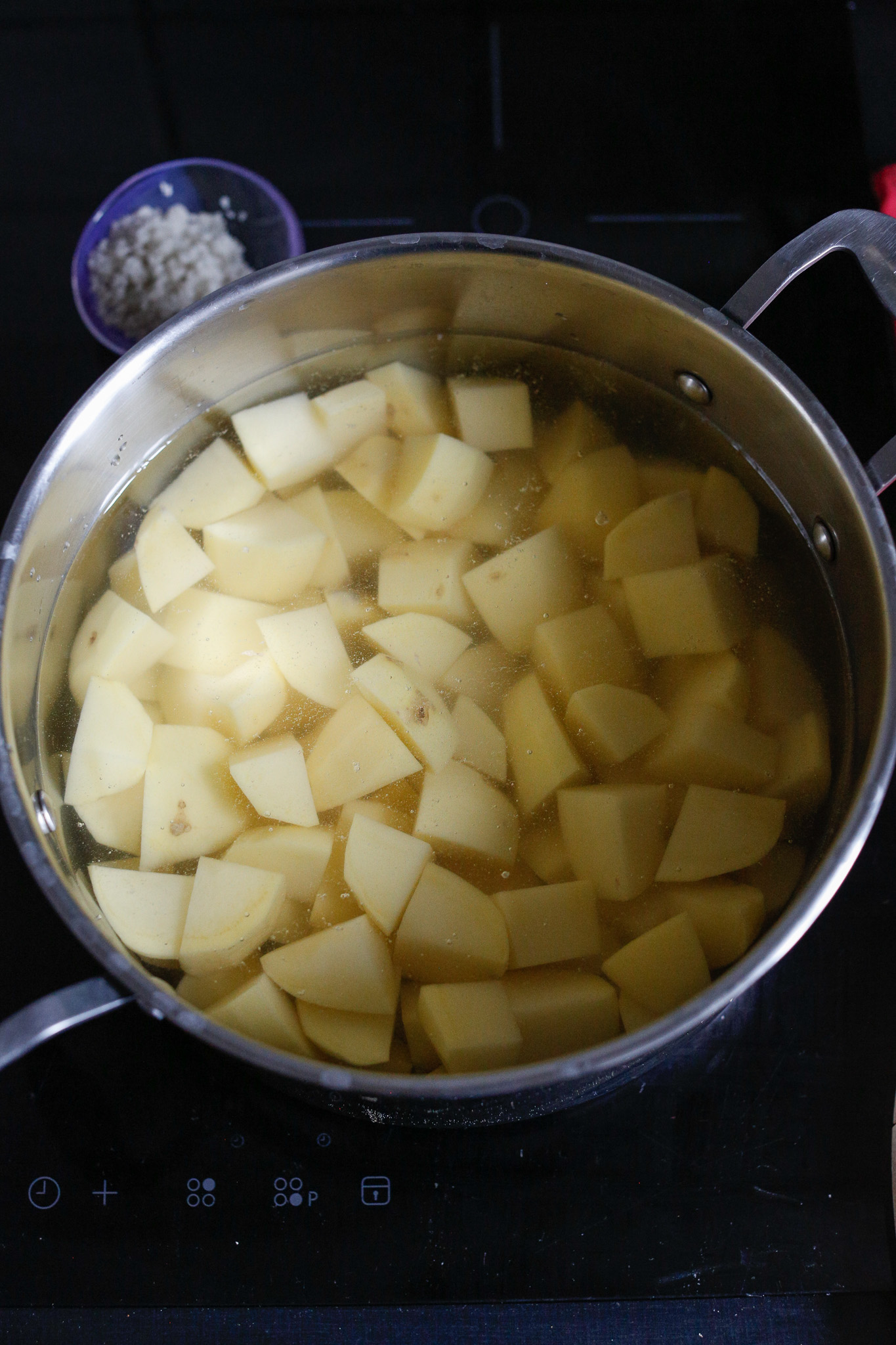 Put all your cut potatoes in a pot and cover them with water, bring to a boil and salt them