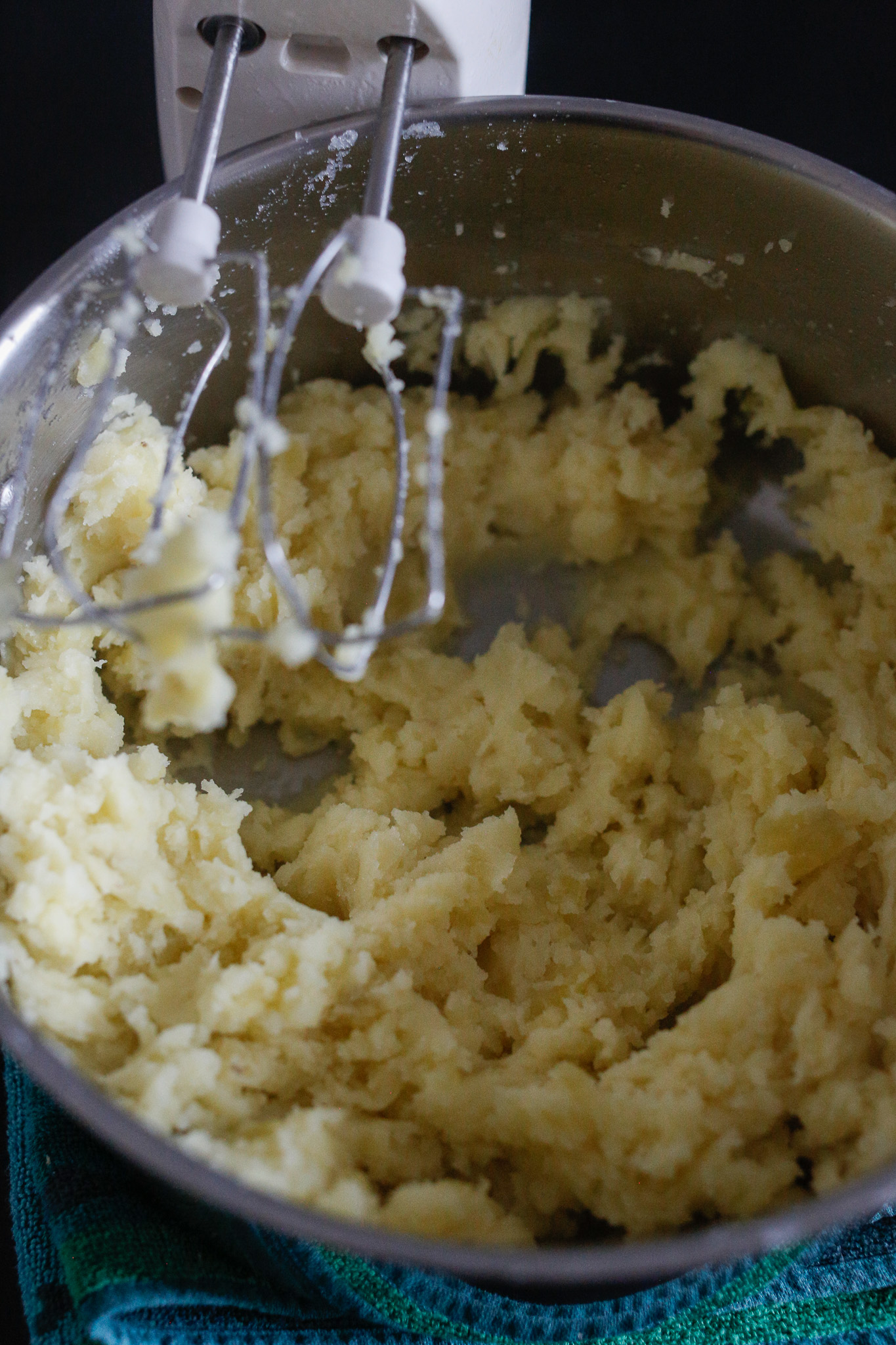 Beat them to about this point and add in half of your milk and butter