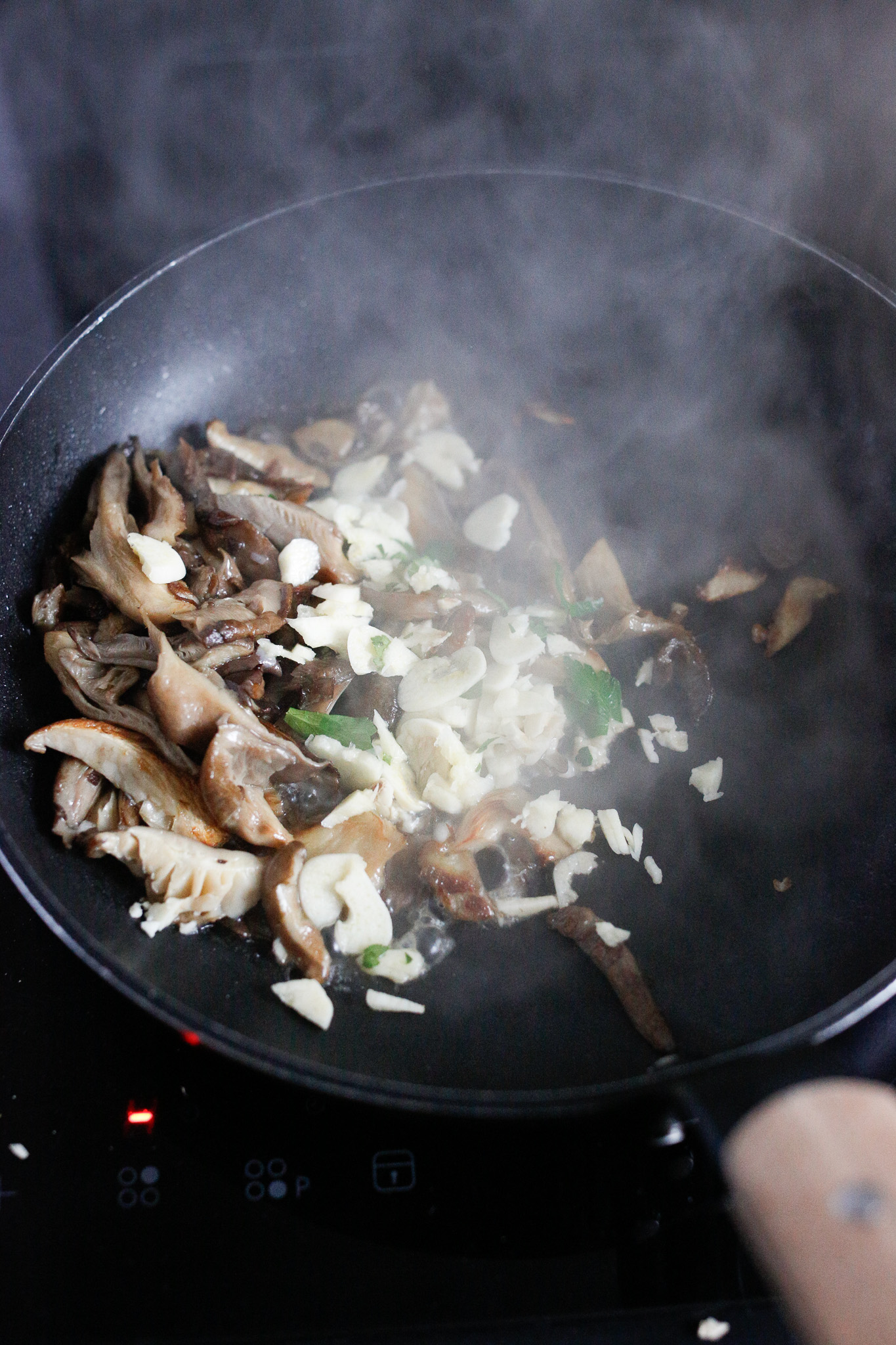 Add garlic in the pan with the mushrooms