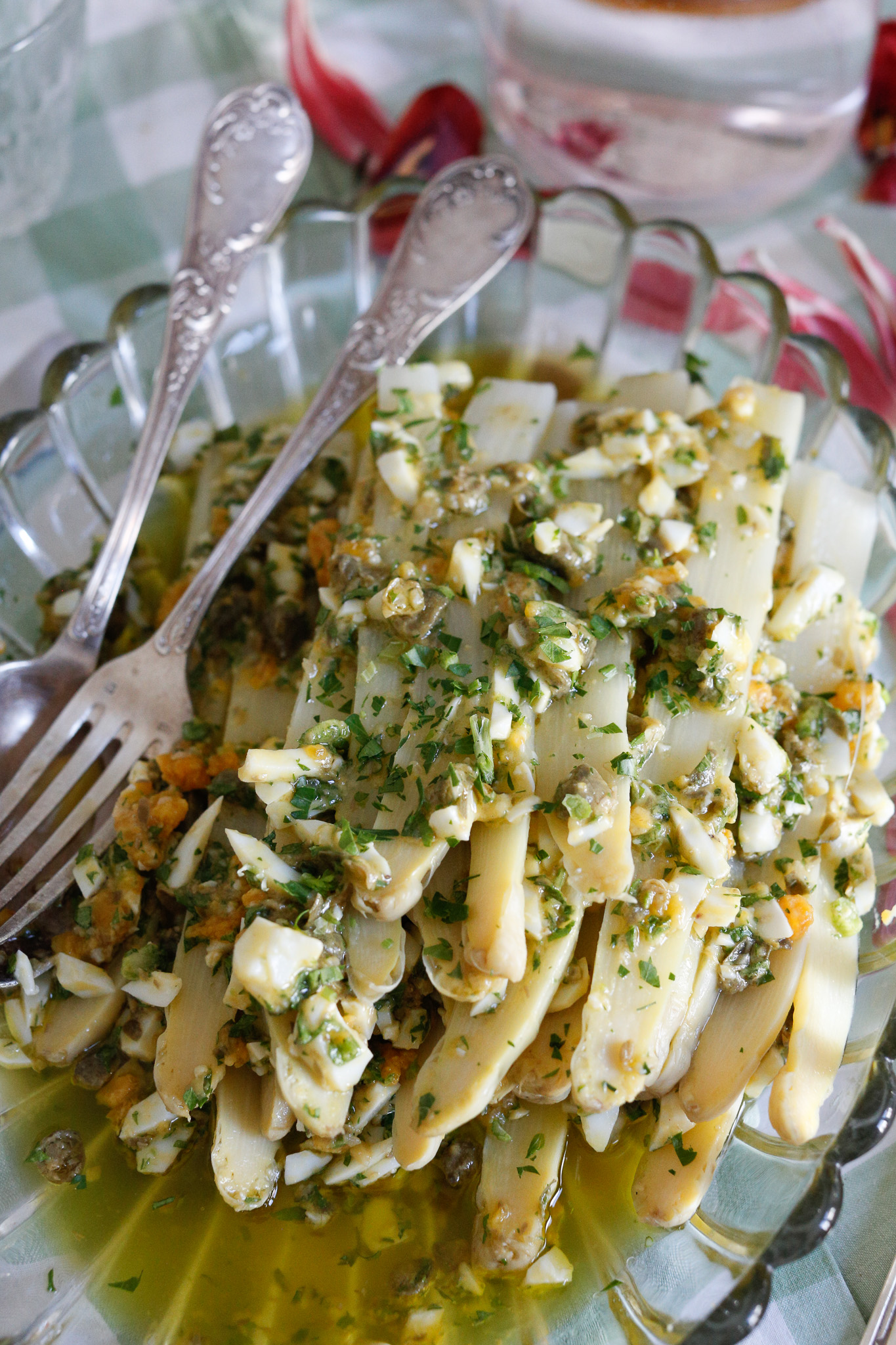 Asparagus Mimosa ready to serve with eggs, capers, olive oil, parsley