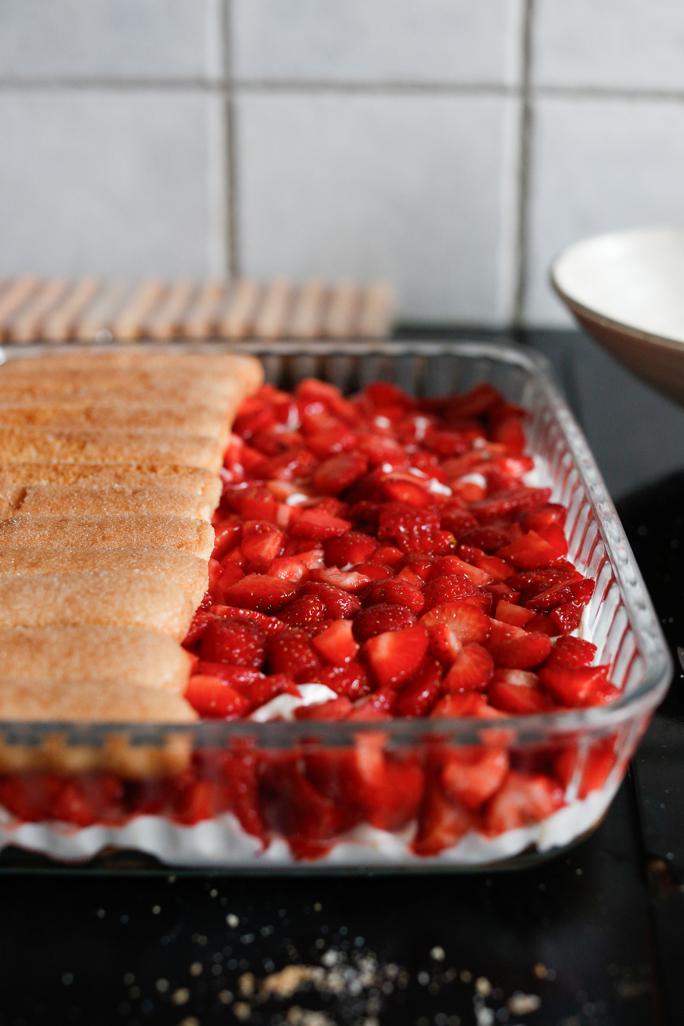 Start your second layer of ladyfingers. Don't forget to soak them in your remaining syrup!