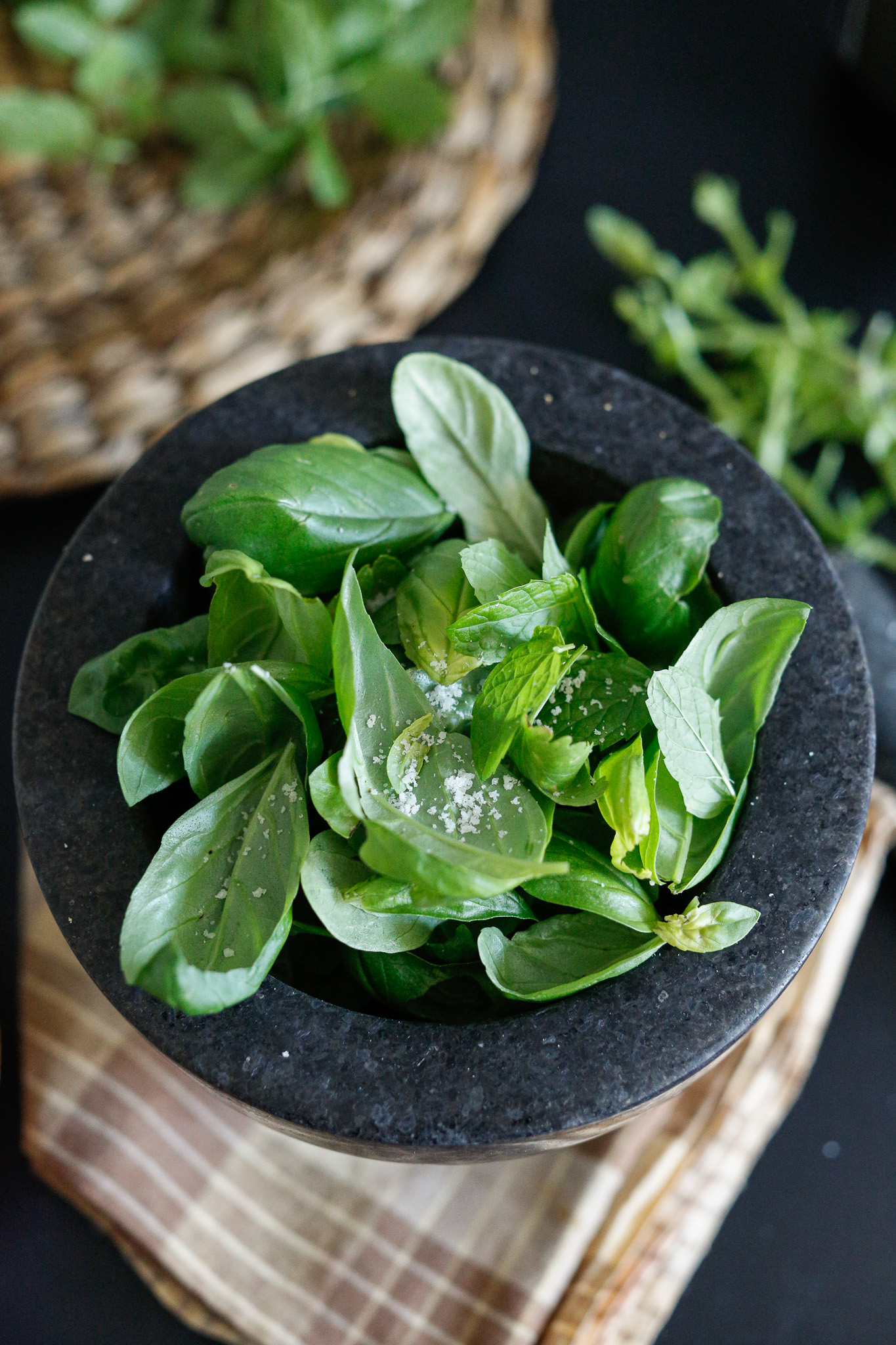 Overflow your basil & mint leaves as they will get crushed down. Add more as you go, until they are all incorporated