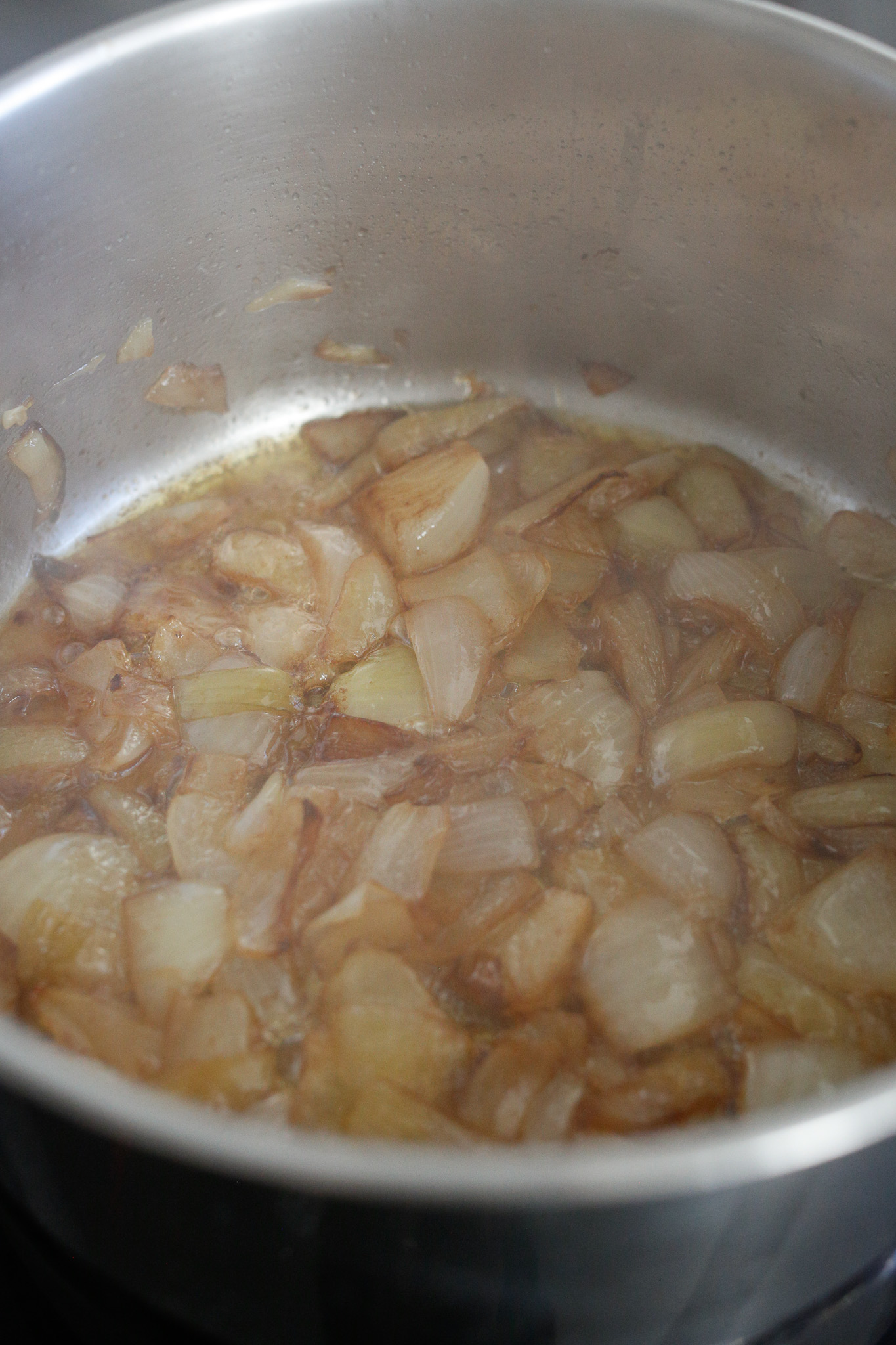 Shake your pot to spread back out your onions for a second deglazing. Allow the vinegar to burn off and your onions to caramelize again