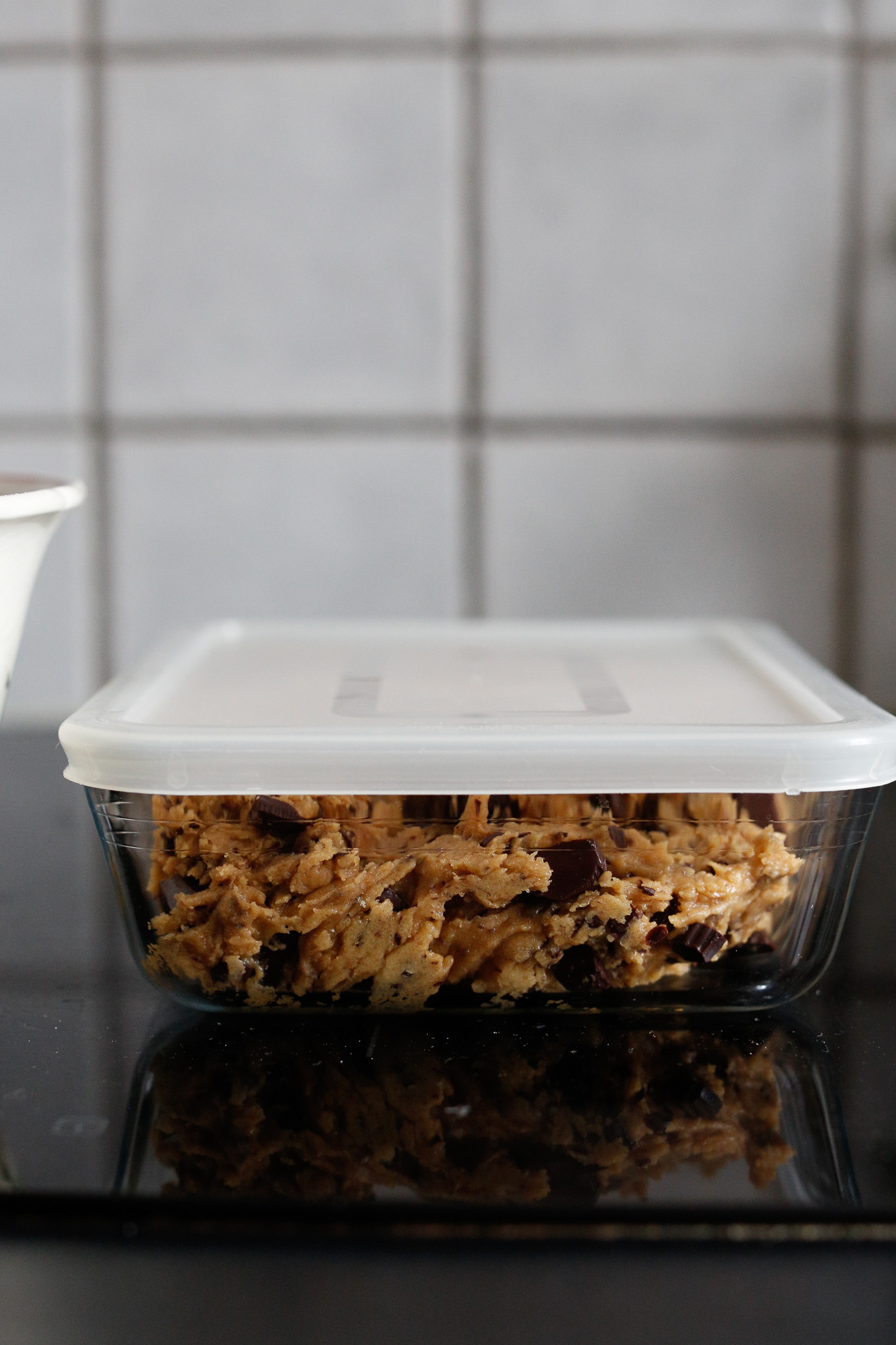 Once you've finished "tasting," transfer your dough to a tupperware with a lid. Close it up and pop it in the fridge overnight or 24 hrs