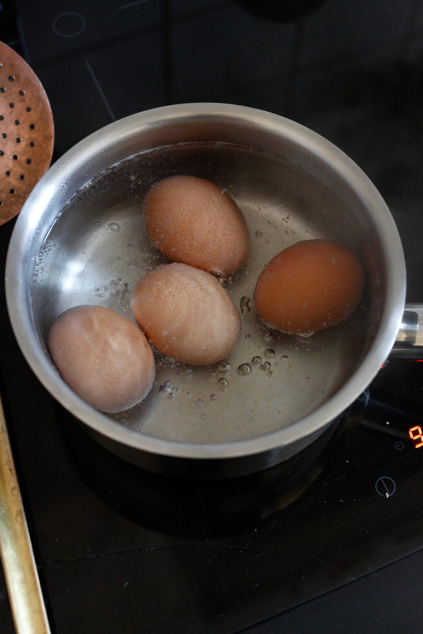 Start by boiling your eggs for 10 minutes and allow them to cool.