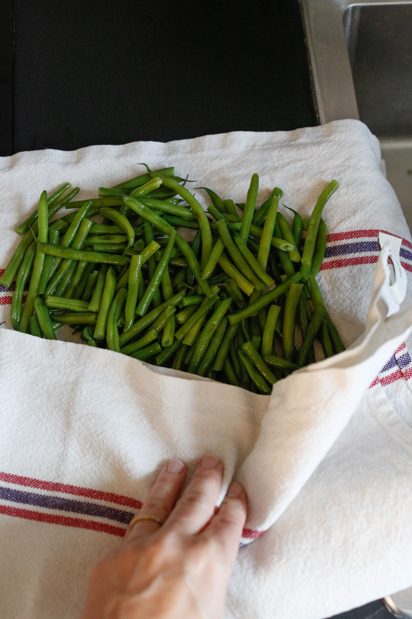 Allow your beans to cool for 5-10 minutes, drain them and dry them in a clean towel. You don't want any excess water on them as it will dilute your salad.