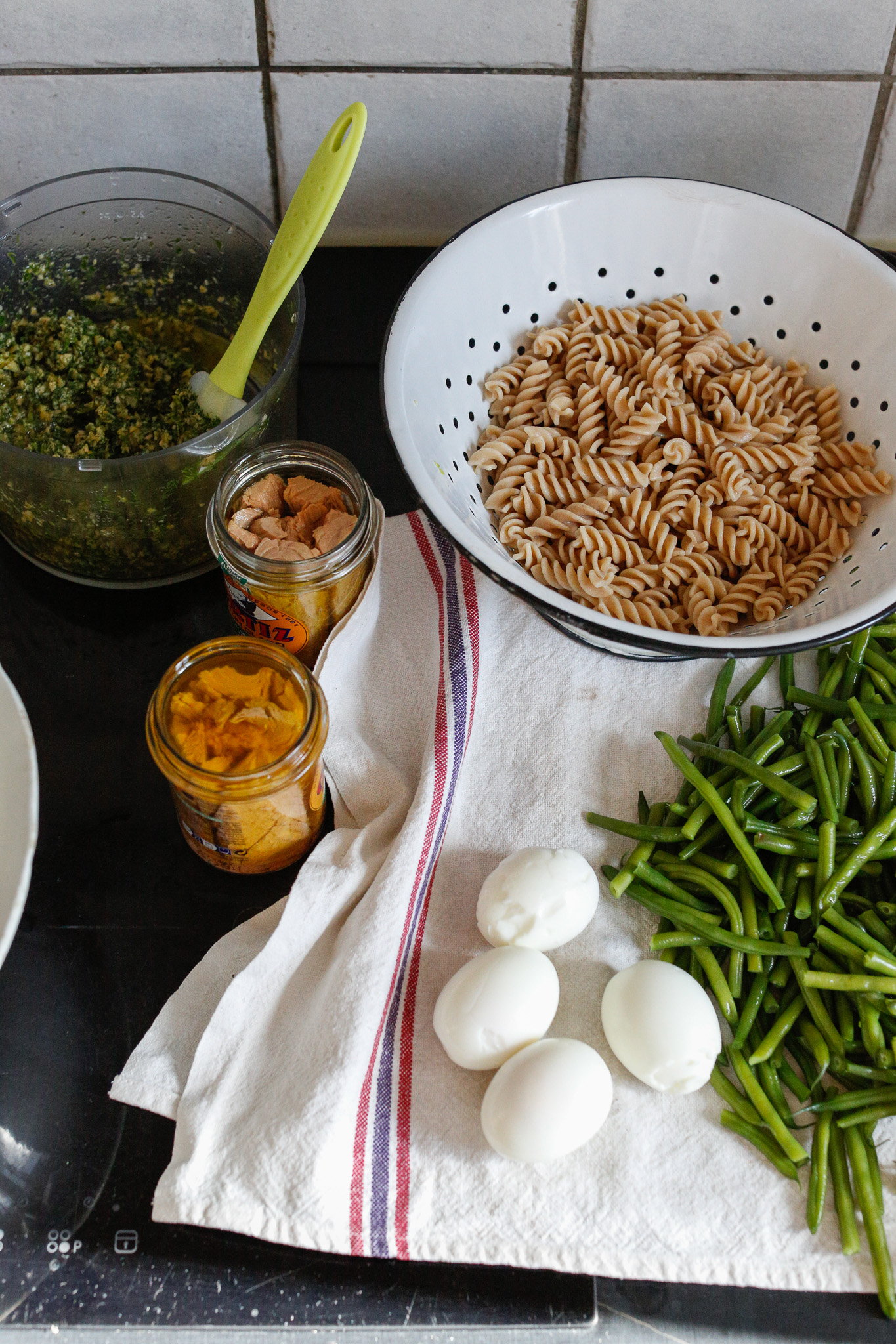 Peel your eggs and collect all your ingredients to assemble your salad.