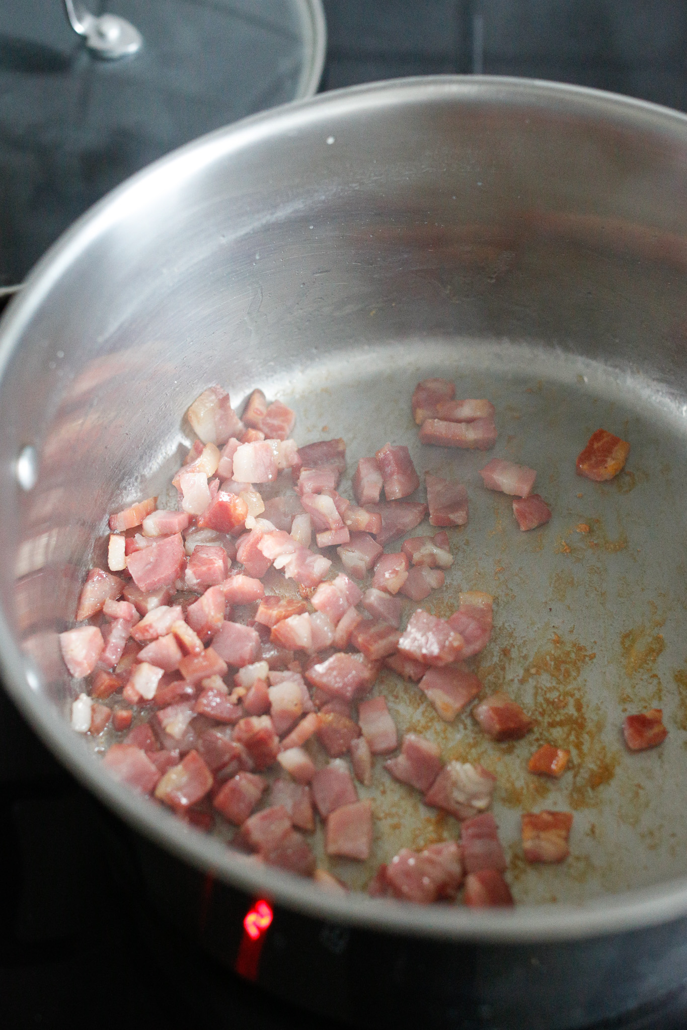 On medium heat, slightly brown your pancetta. Once browned, take it out and put it aside.