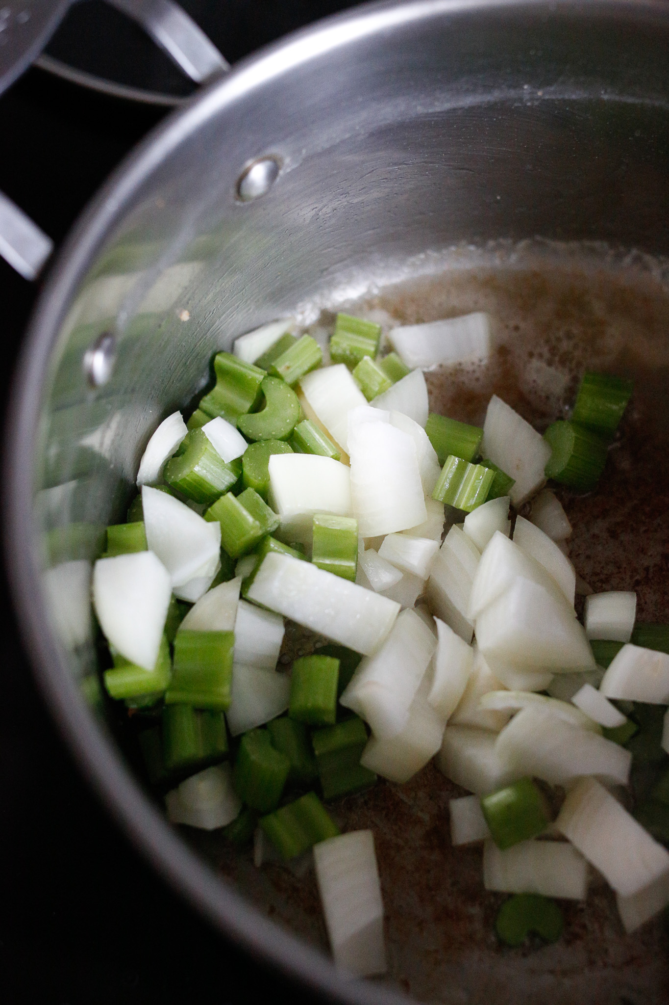 Add in your onions and celery together and allow to sautee until translucent on medium heat.
