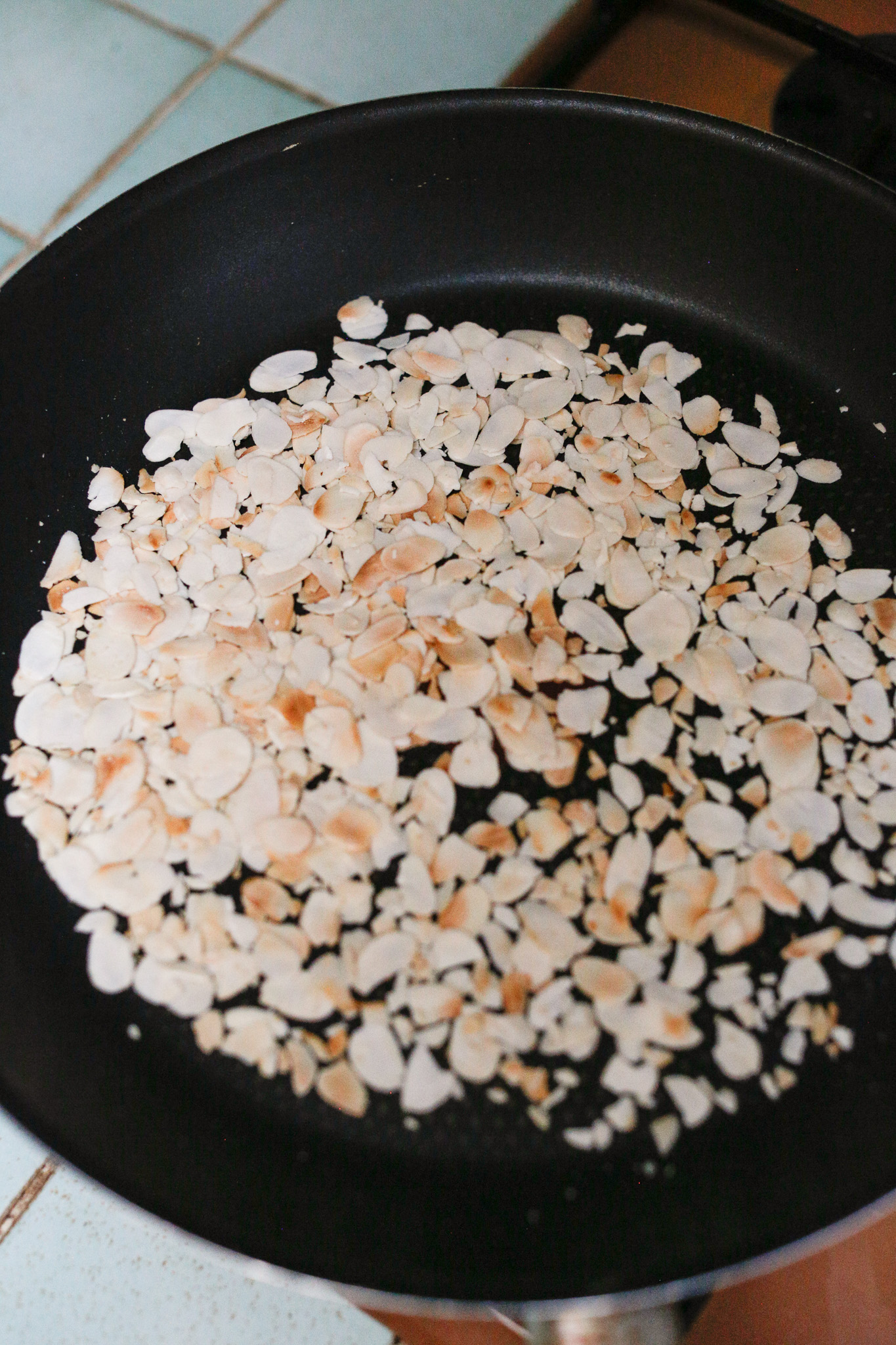 Don't go too far away from your stove because once they start browning it goes fast. Make sure to flip your almonds in the pan or stir them if you're not comfortable flipping.