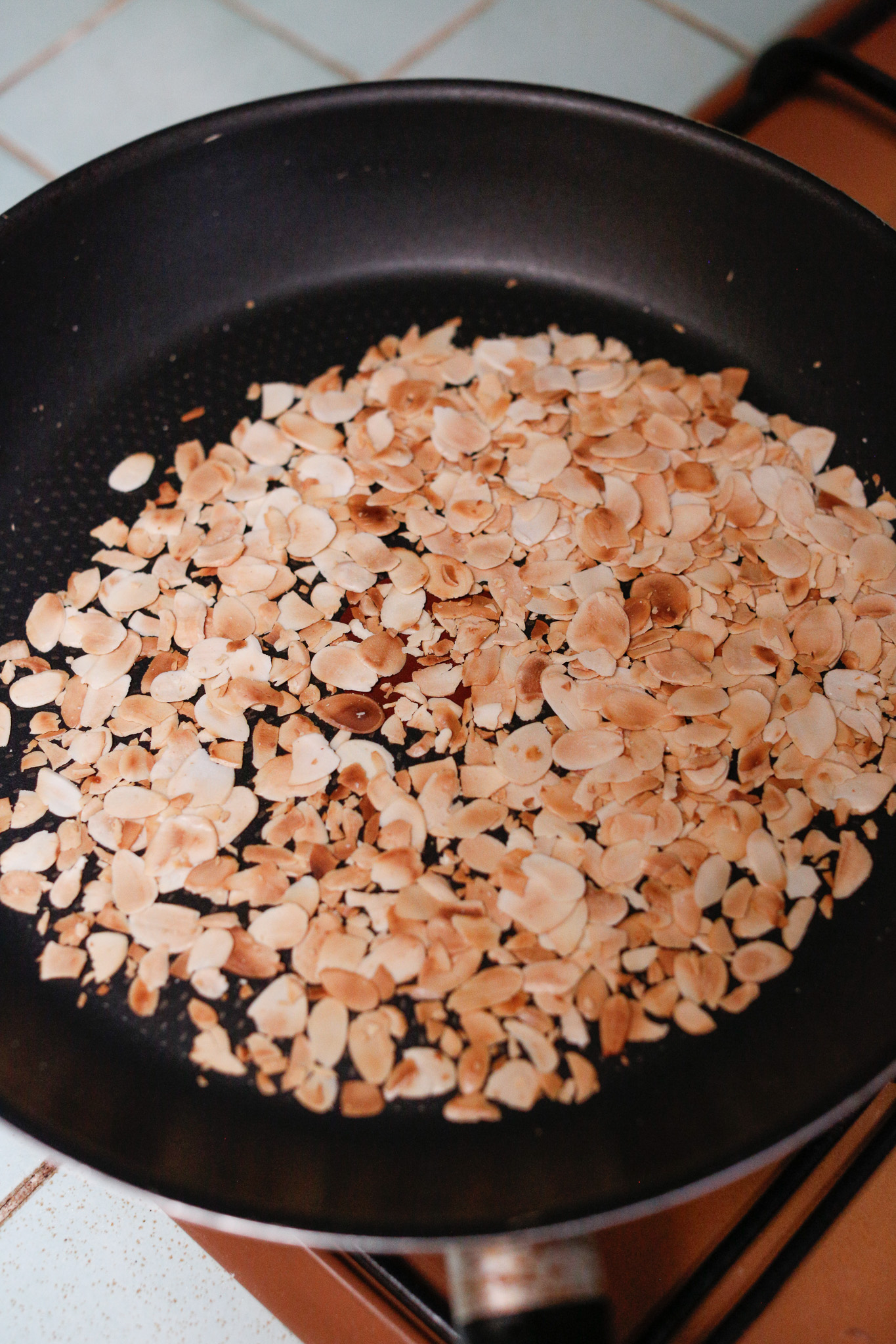 When they are nice and toasted, transfer them from the pan into a bowl or plate to cool.