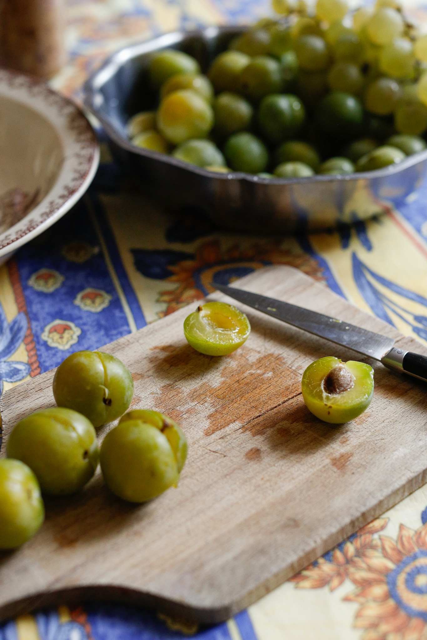 I like to do all the plums by steps. Cut all the seams, pull each plum apart and then de pit each plum. I find that it goes quicker than one by one.