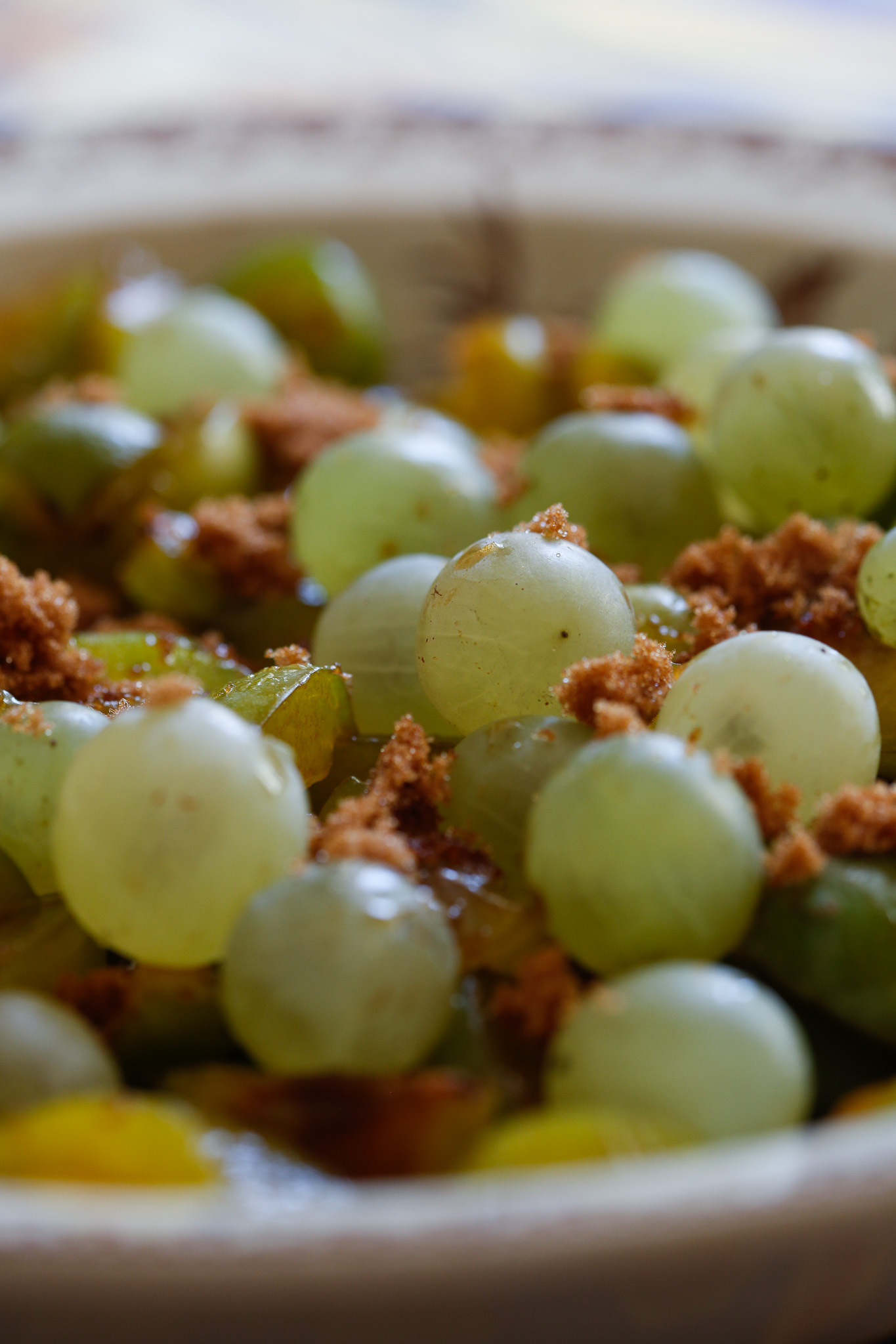 Add your grapes into the bowl with your sugar.