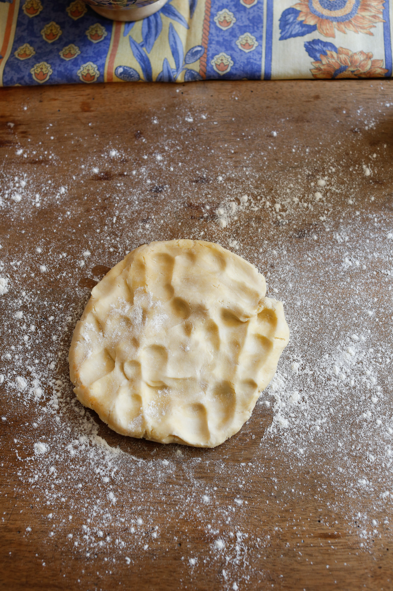 Had I flattened out my dough into a disk before putting in the fridge I would skip this step of flattening it out with my fingertips.