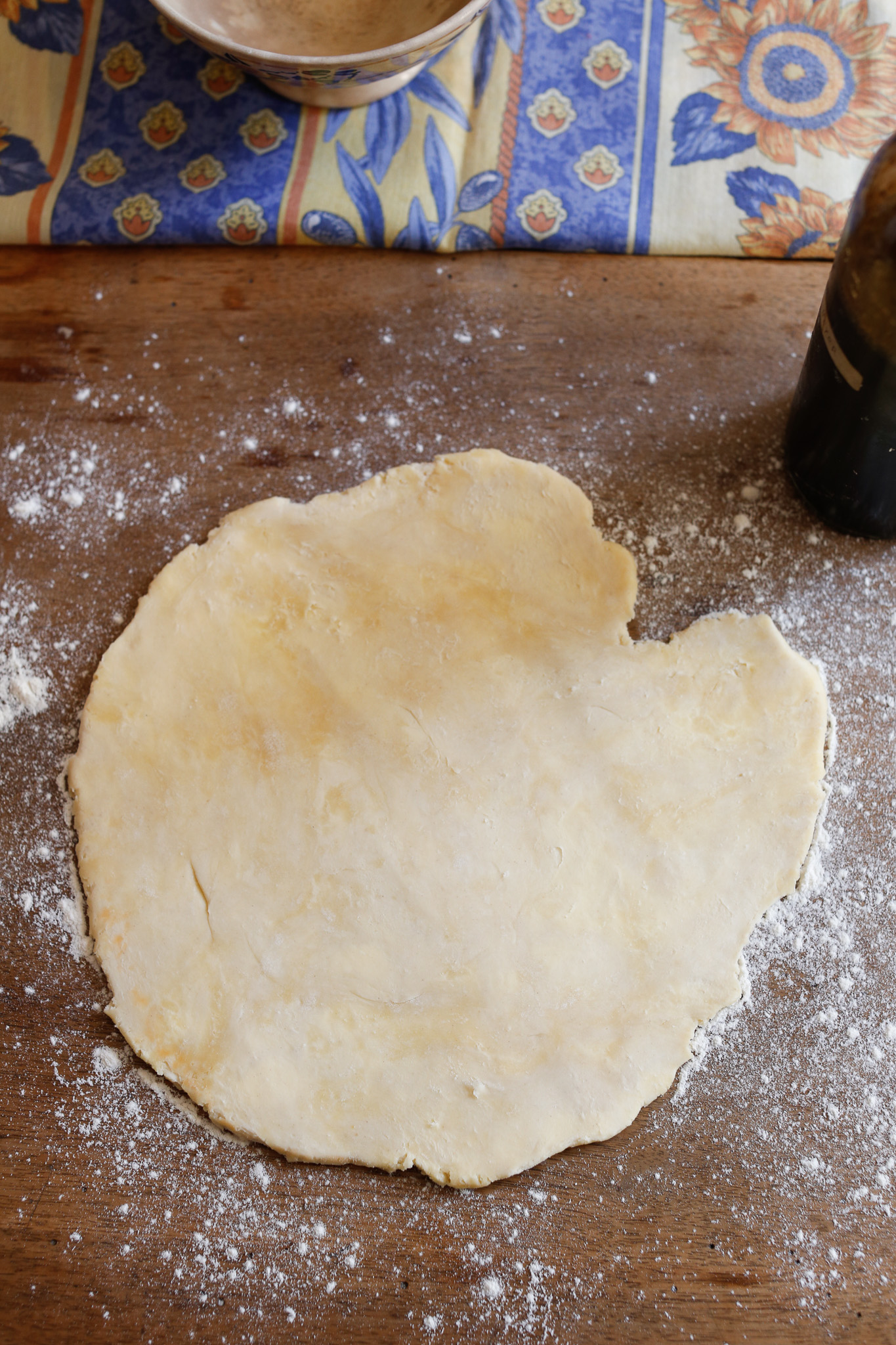 Roll and turn your dough over and over. If you have another way you like to roll out your dough into an approxiamate circle, do that instead.