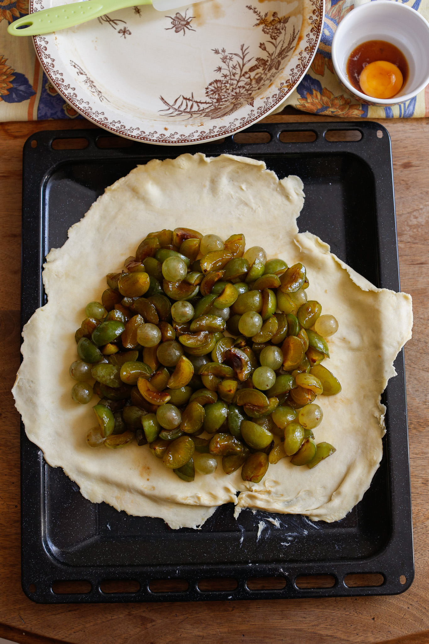 After you lay your dough down and unfold it, load it up with your fruit. Make sure to leave sufficient edge space in order to fold it over.