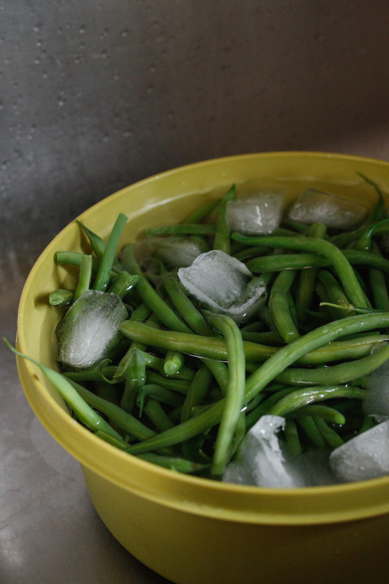 Then plop your hot beans into the ice bath to halt the cooking process. Limp beans are not so fun! Et voila your beans are cooked and ready for anything.