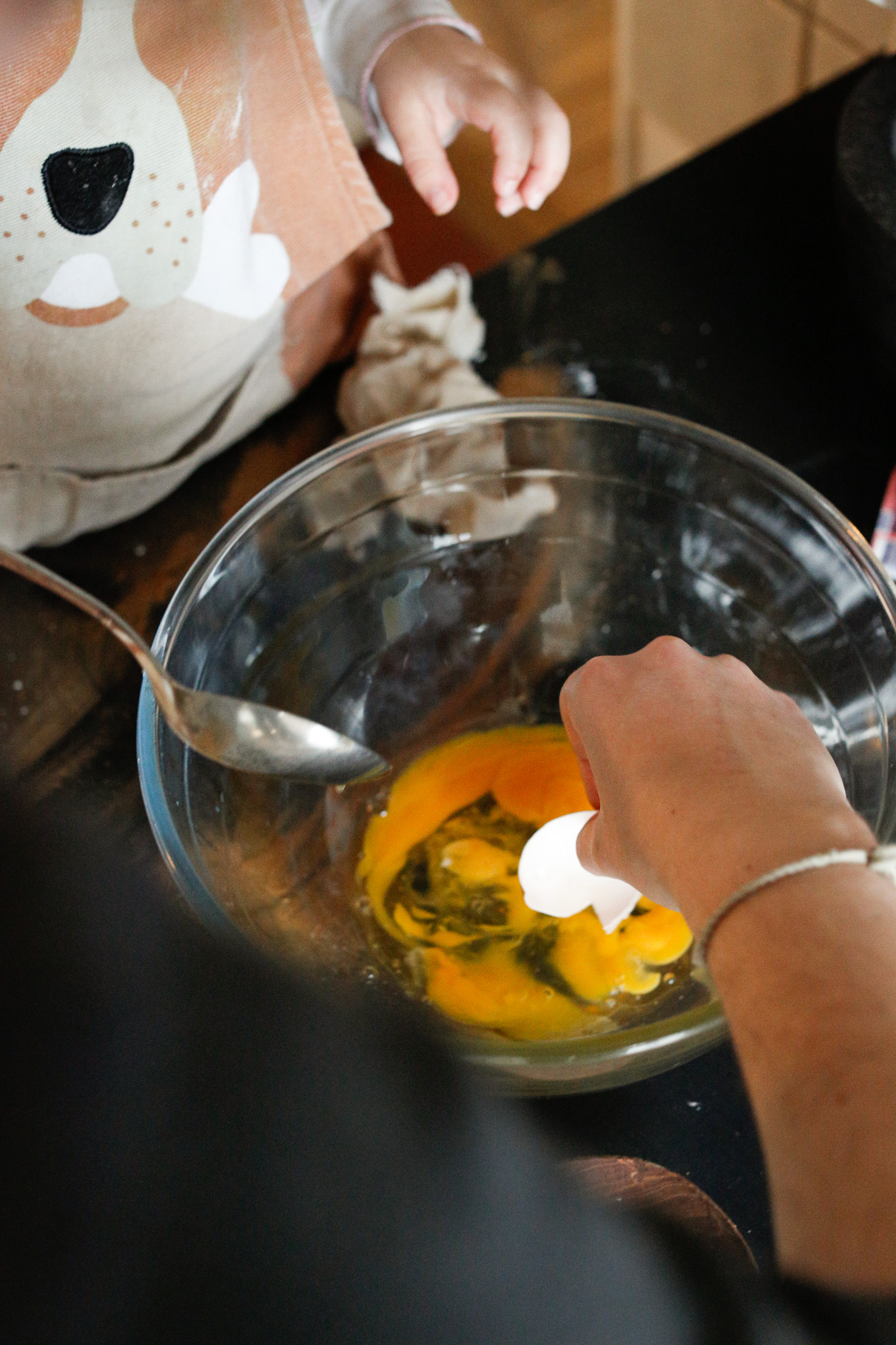 If eggshell falls into the bowl use a larger piece of shell to scoop it out. Shell sticks to shell much easier than a spoon or fingers!