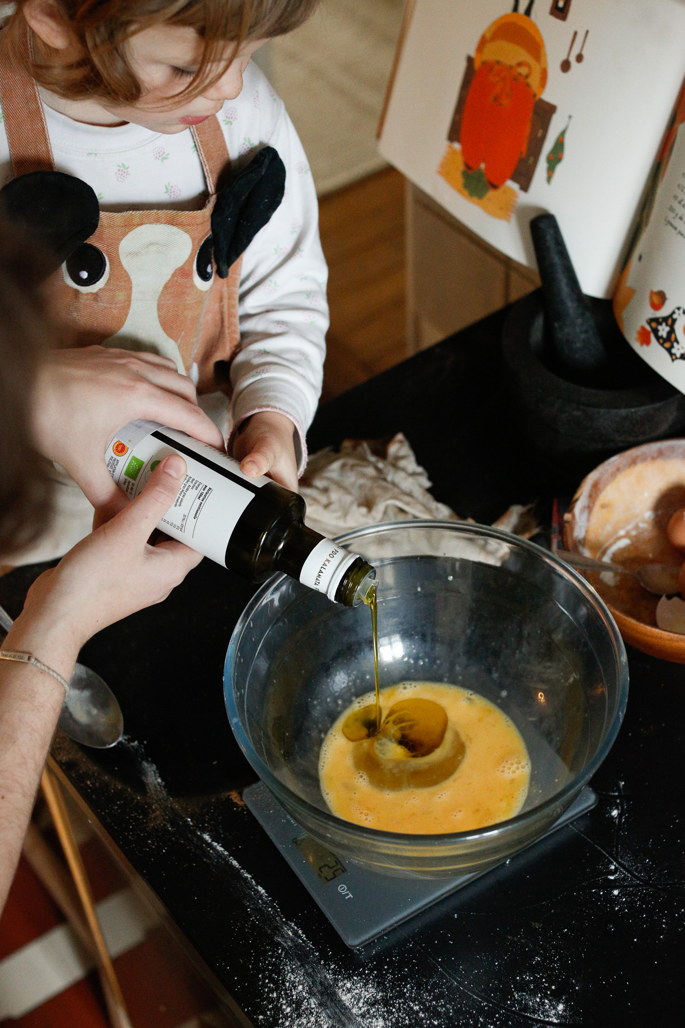 In this case pouring in the olive oil directly into the bowl should be guided by an adult as there is no going back. Feel free to pour it into a vessel first and hand the vessel to the kiddo, especially if they are younger.
