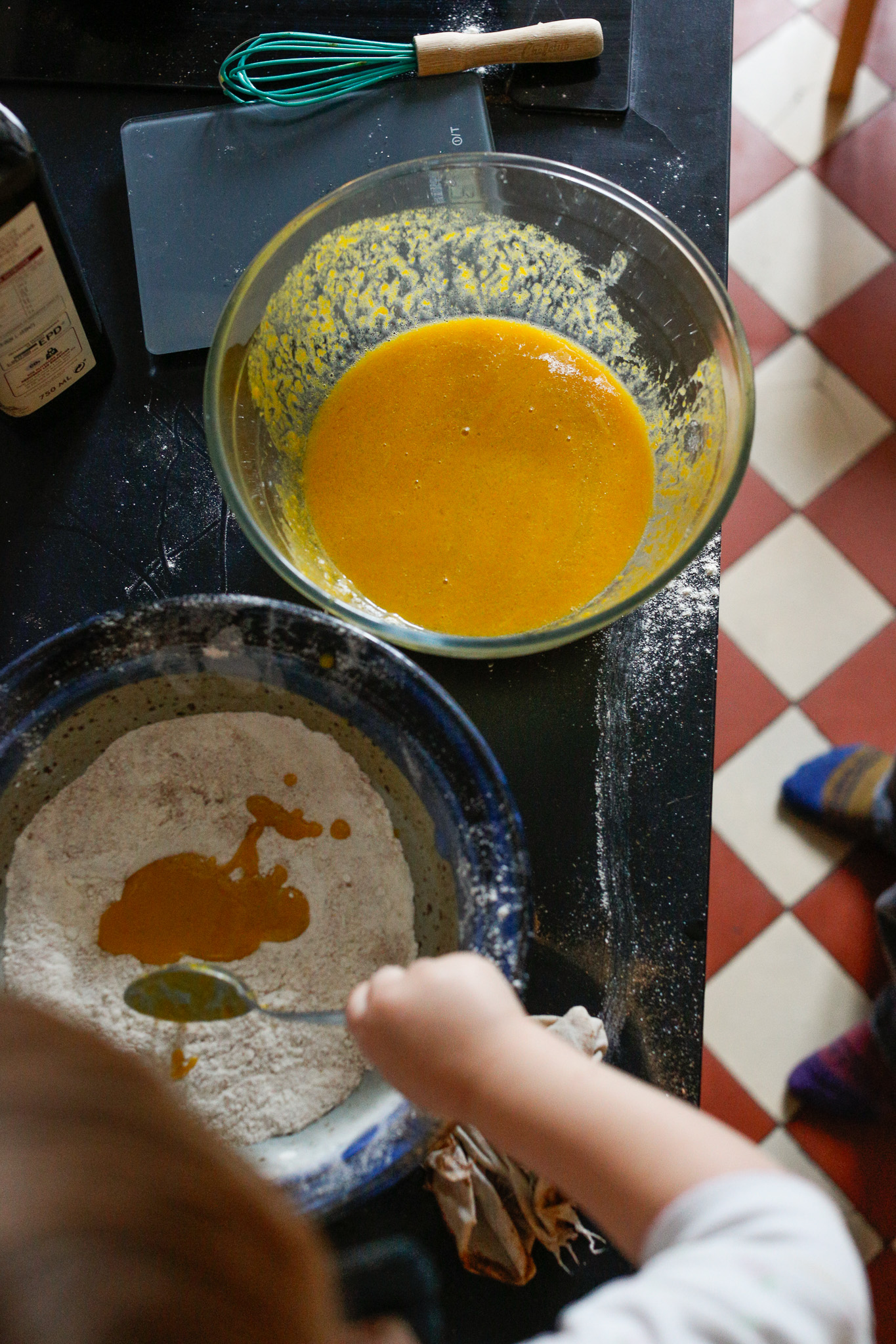 She wanted to add the wet ingredients into the dry with her little spoon. Fine. We let her explore this and for her to ask for help.