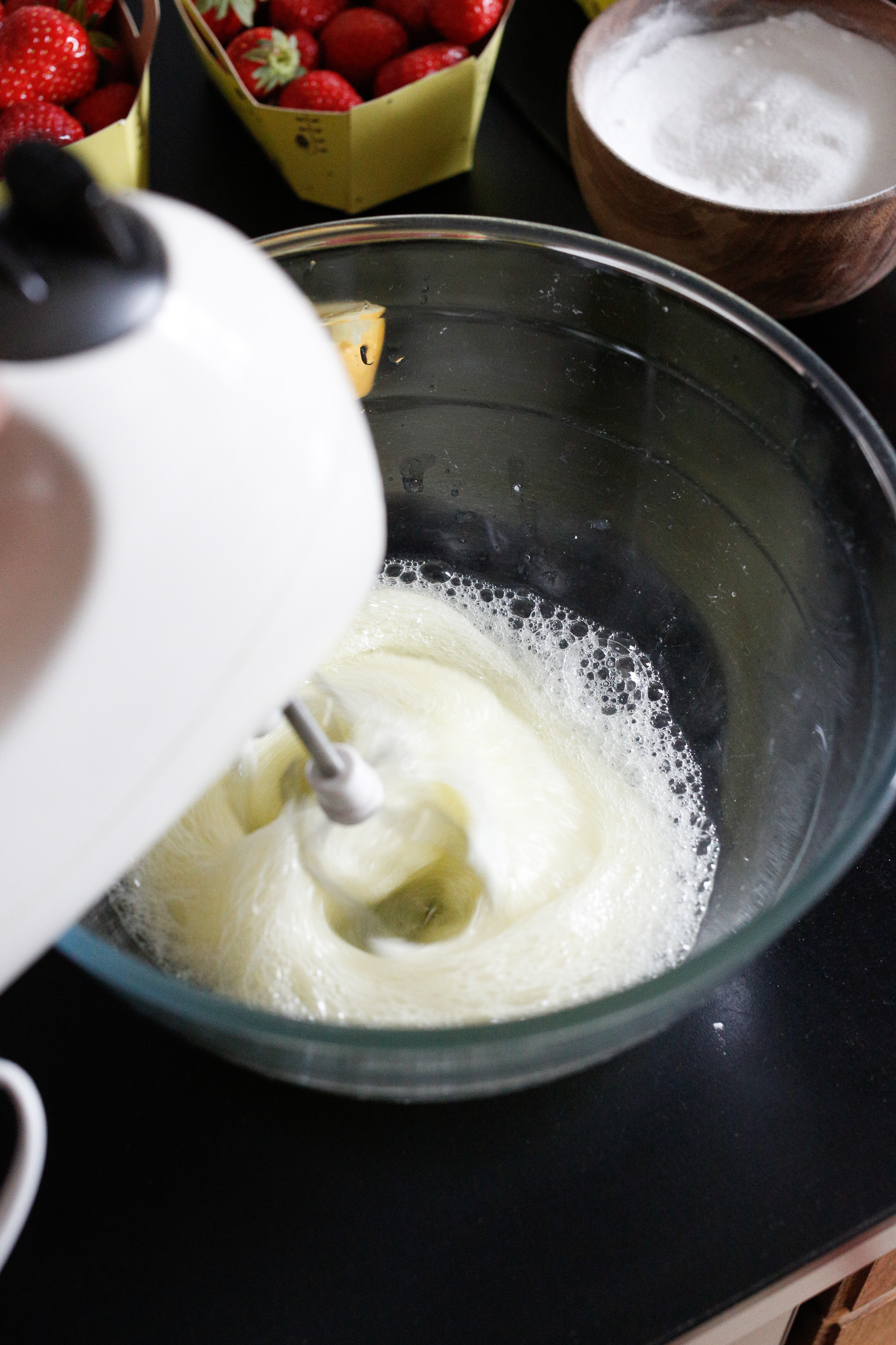 Once they are looking like this you may start adding in your sugar one spoonful at a time, beating in between.