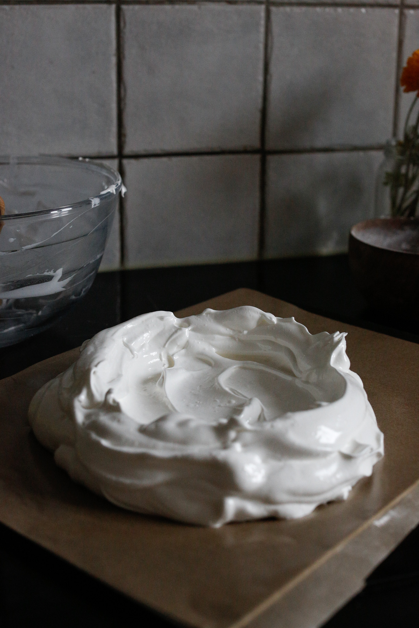 Do your best to make a nest. The center of your meringue will poof up regardless while it bakes so make the "walls" high.
