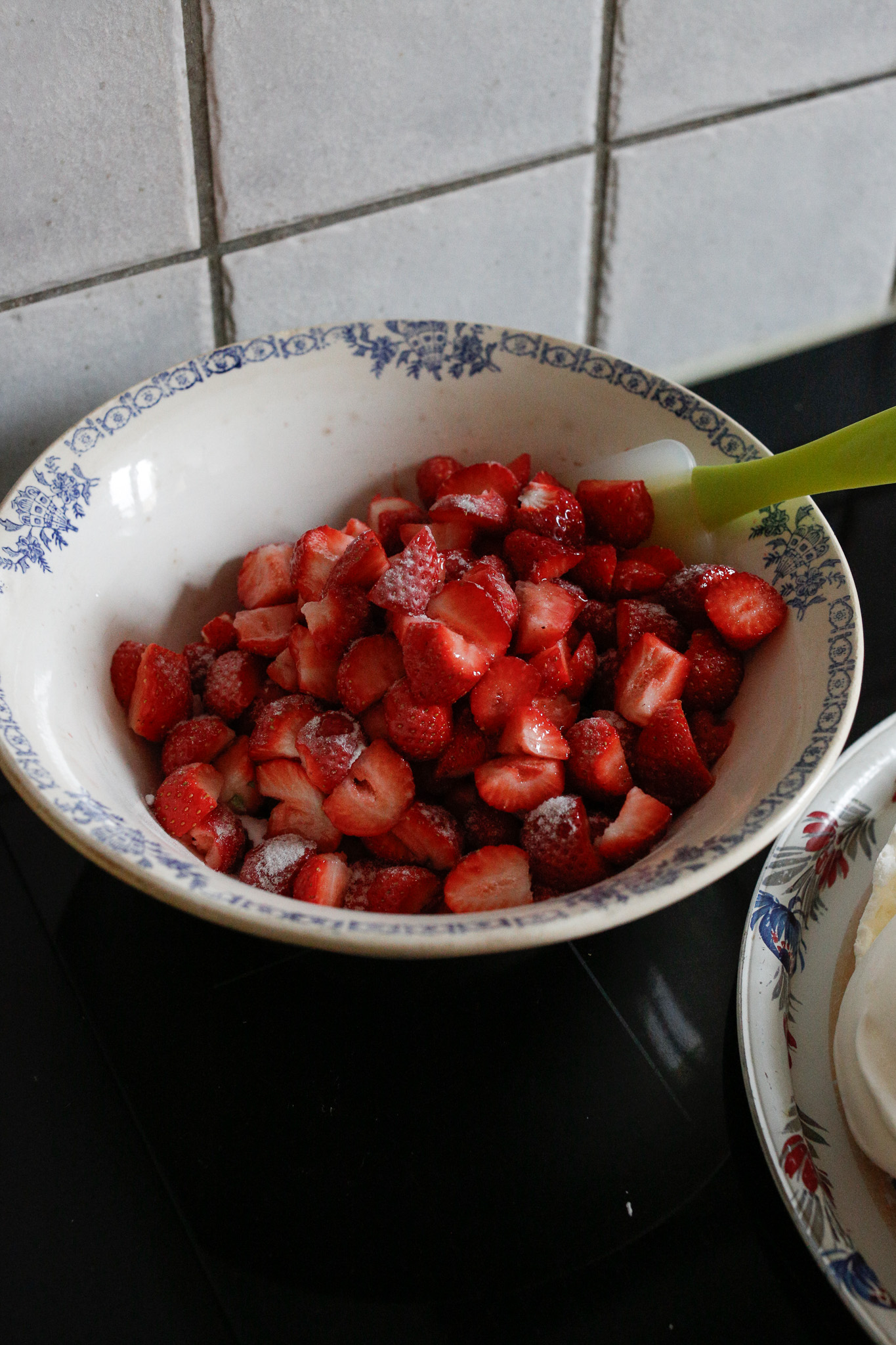 I always sweeten my strawberries a touch. I do this at the last minute because the sugar breaks them down a bit. Make sure to fold them over themselves with a rubber spatula so that you don't smash them.
