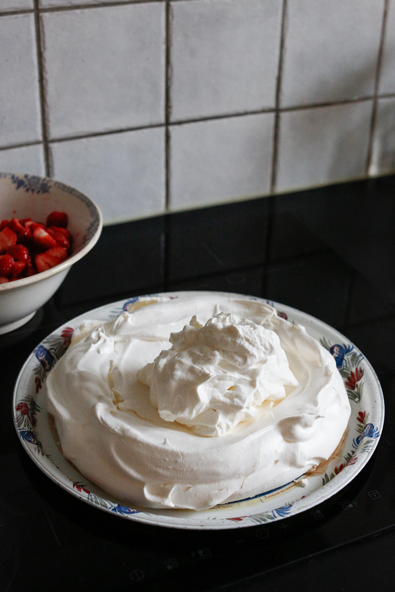Once your meringue is completely cooled add on your freshly whipped cream.