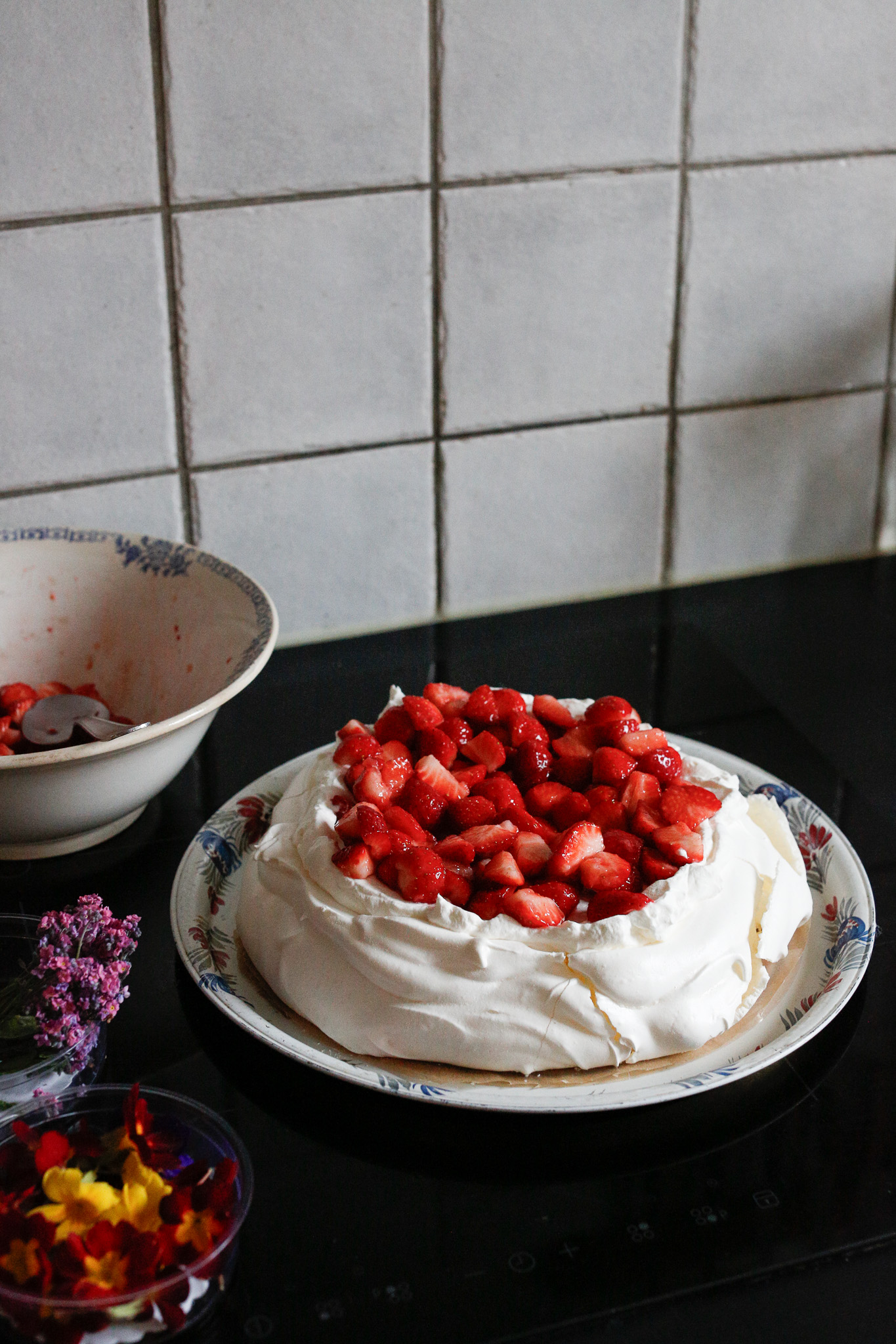 Add your strawberries. You could just keep them in the center like this, keep piling them on and let them "spill over" to give you a rustic look.