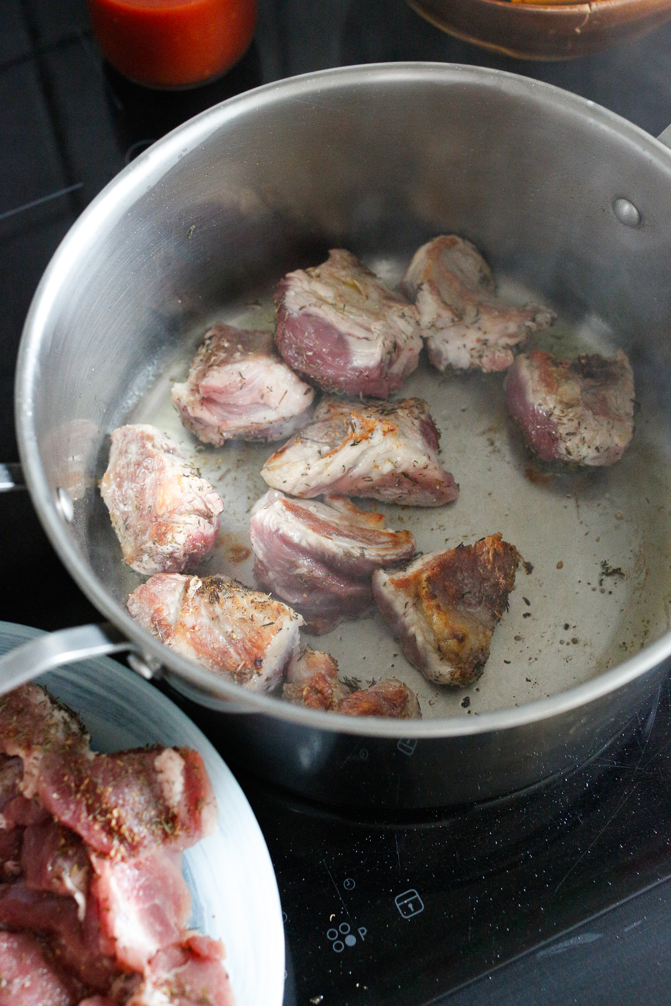 I use a soup spoon and fork to turn the pieces for further browning. Tongs are another option.