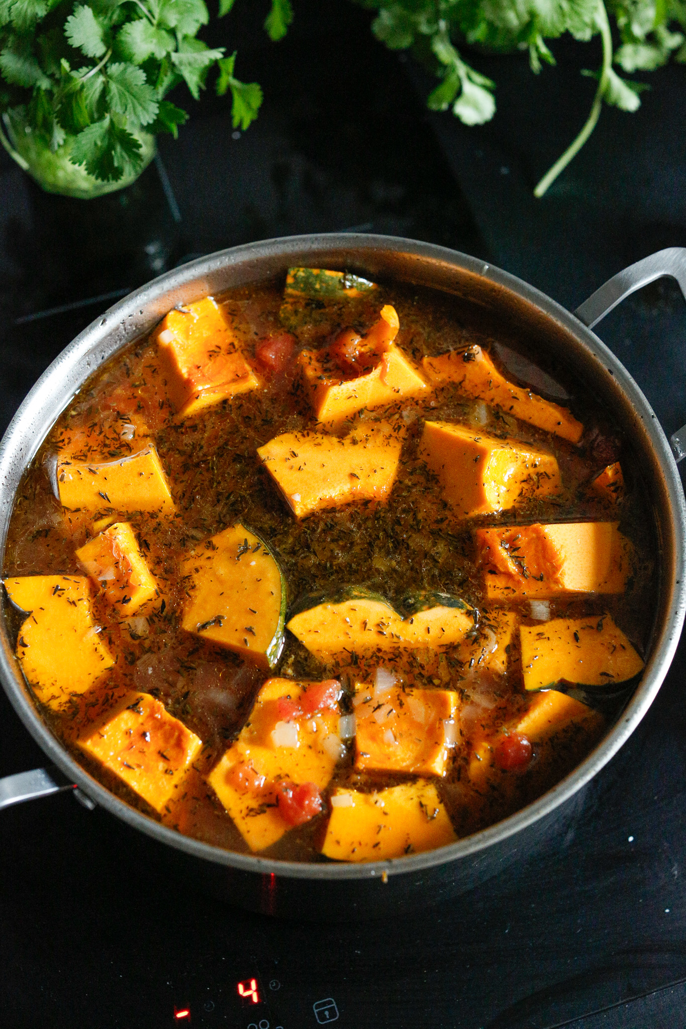Add in your kabocha cubes and allow them to simmer for 20ish minutes or until they are nice and tender.
