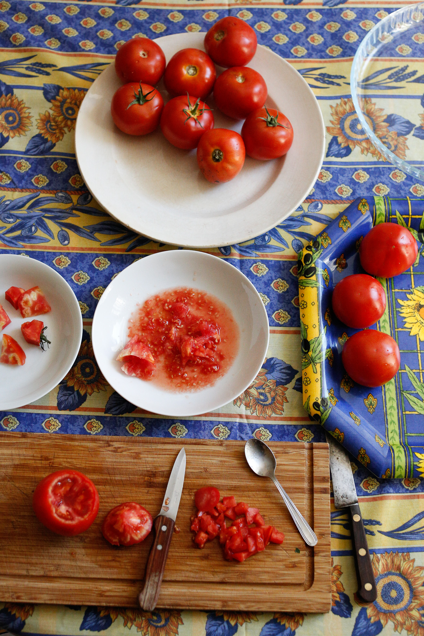 To prep my tomatoes I have a cutting board, a tray to drain the tomatoes, a bowl for the insides of the tomatoe and a compost bowl.