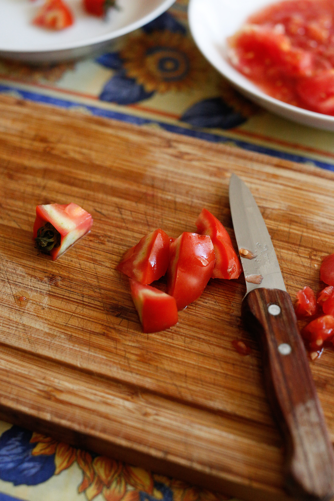 In attempts not to waste, I cut around the stem to use the tomato left on it. You can keep these whole and pop them on as little hats before you cook them. Lots of people do this, I don't.