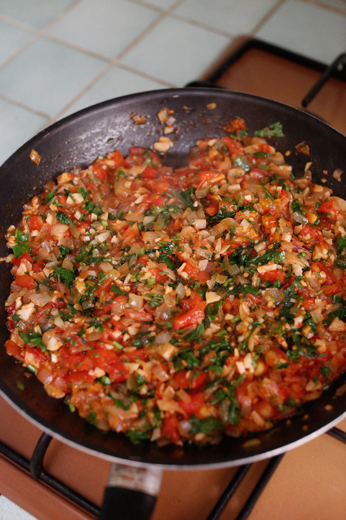 After this cooks down a bit, 15-20 minutes add in your parsley. Give it a stir and pull it off the heat.