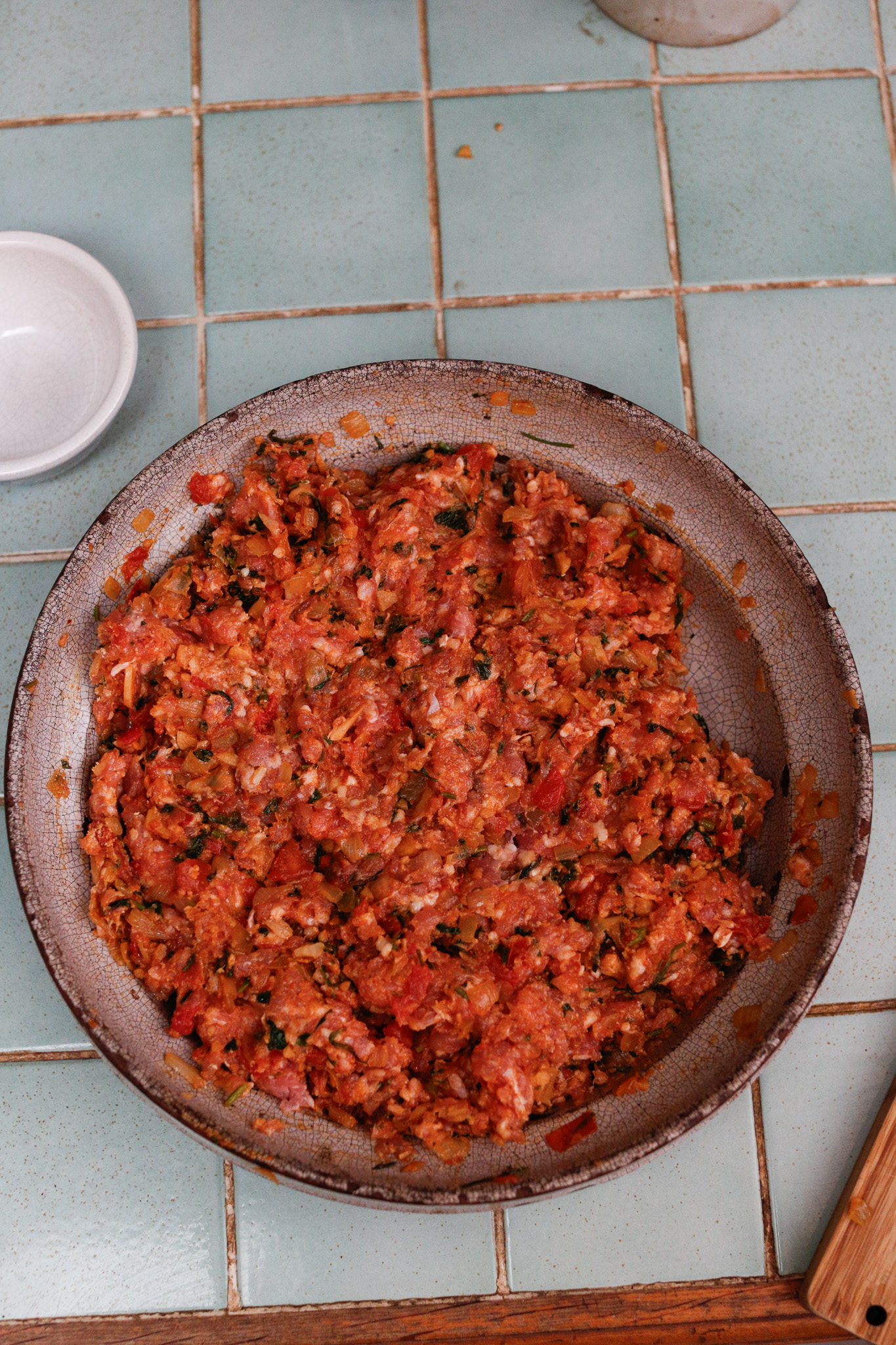 I mix this up with my hands. I find that it goes much quicker and I love the way raw meat feels!