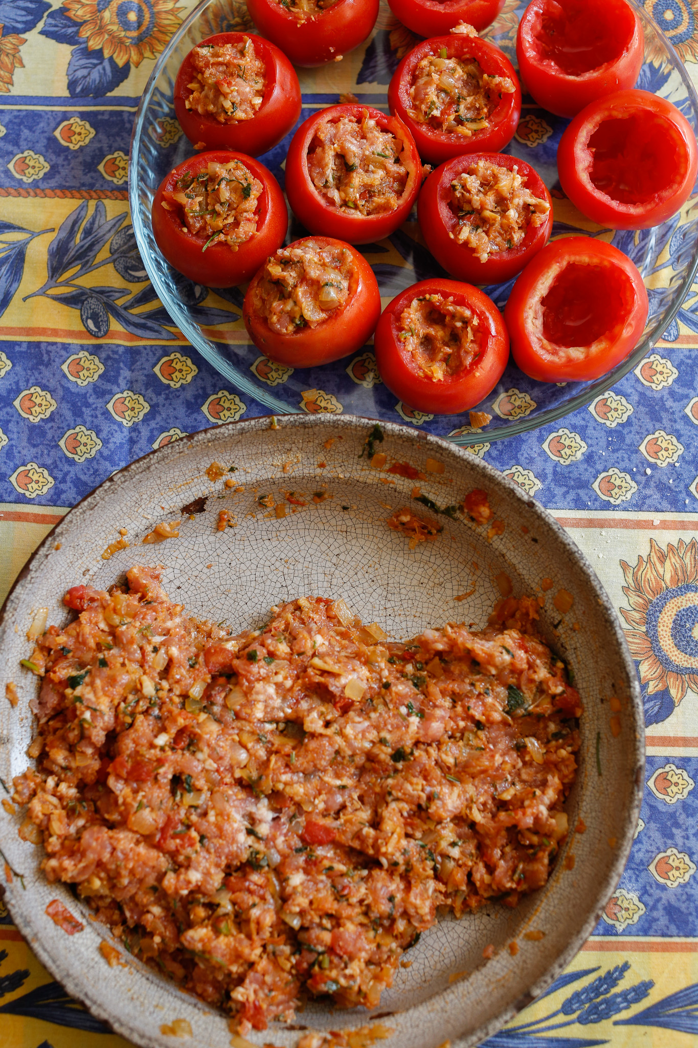 Your ready to stuff! Use your hands or a small spoon. Either way, make sure you fill the cavity of the tomato and then pile on the stuffing to make a dome. If you are adding your tomato cap, this is the time to do it.