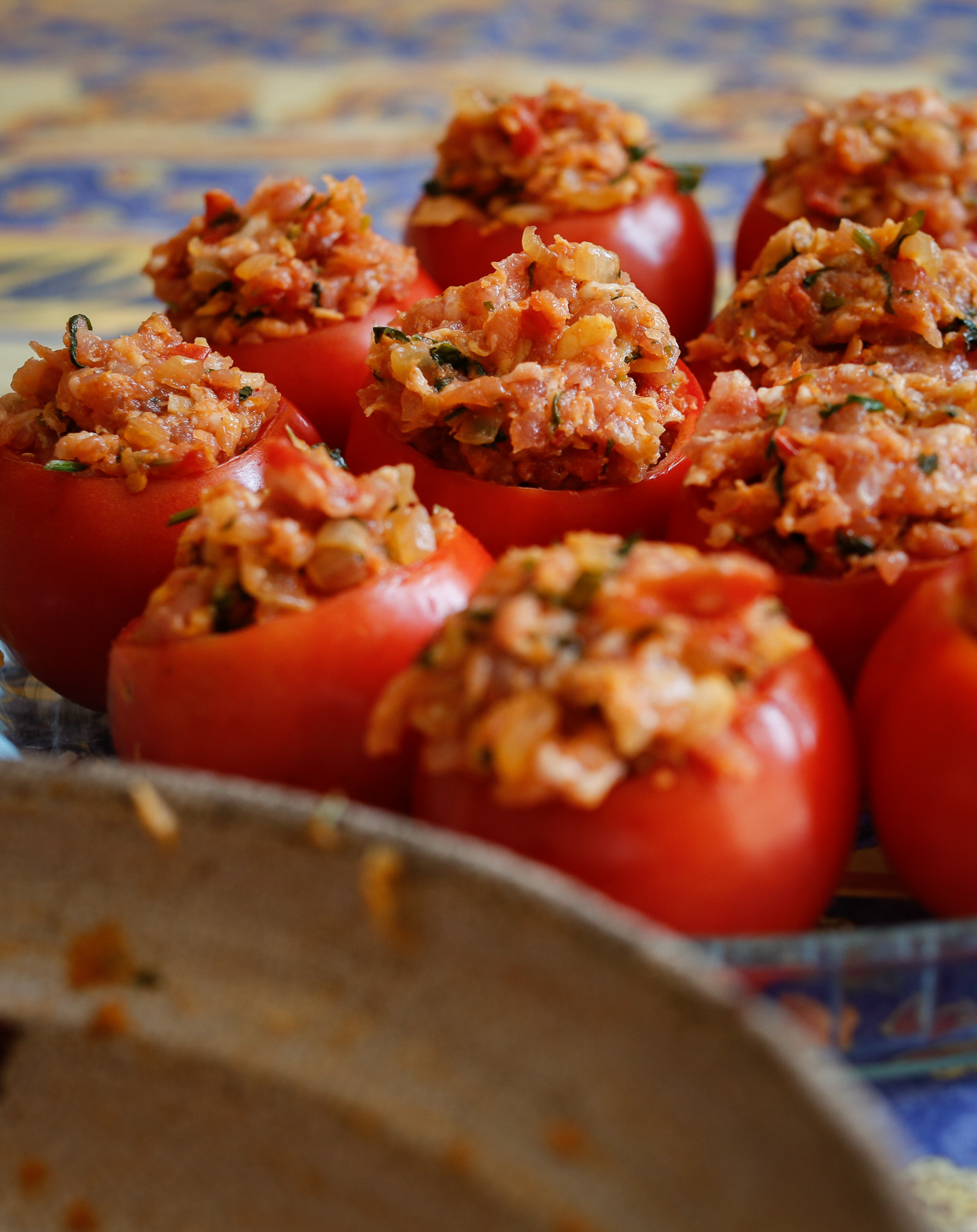 Prepared stuffed tomatoes ready for the oven