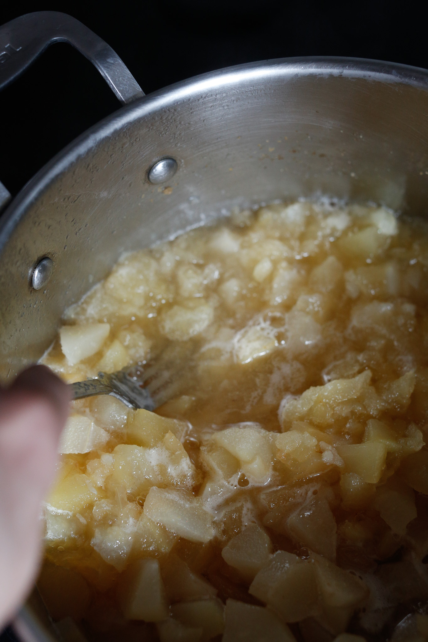 Use a fork to crush up the fruit to a texture of your liking. You can, even, use an immersion blender if you want a soft applesauce.