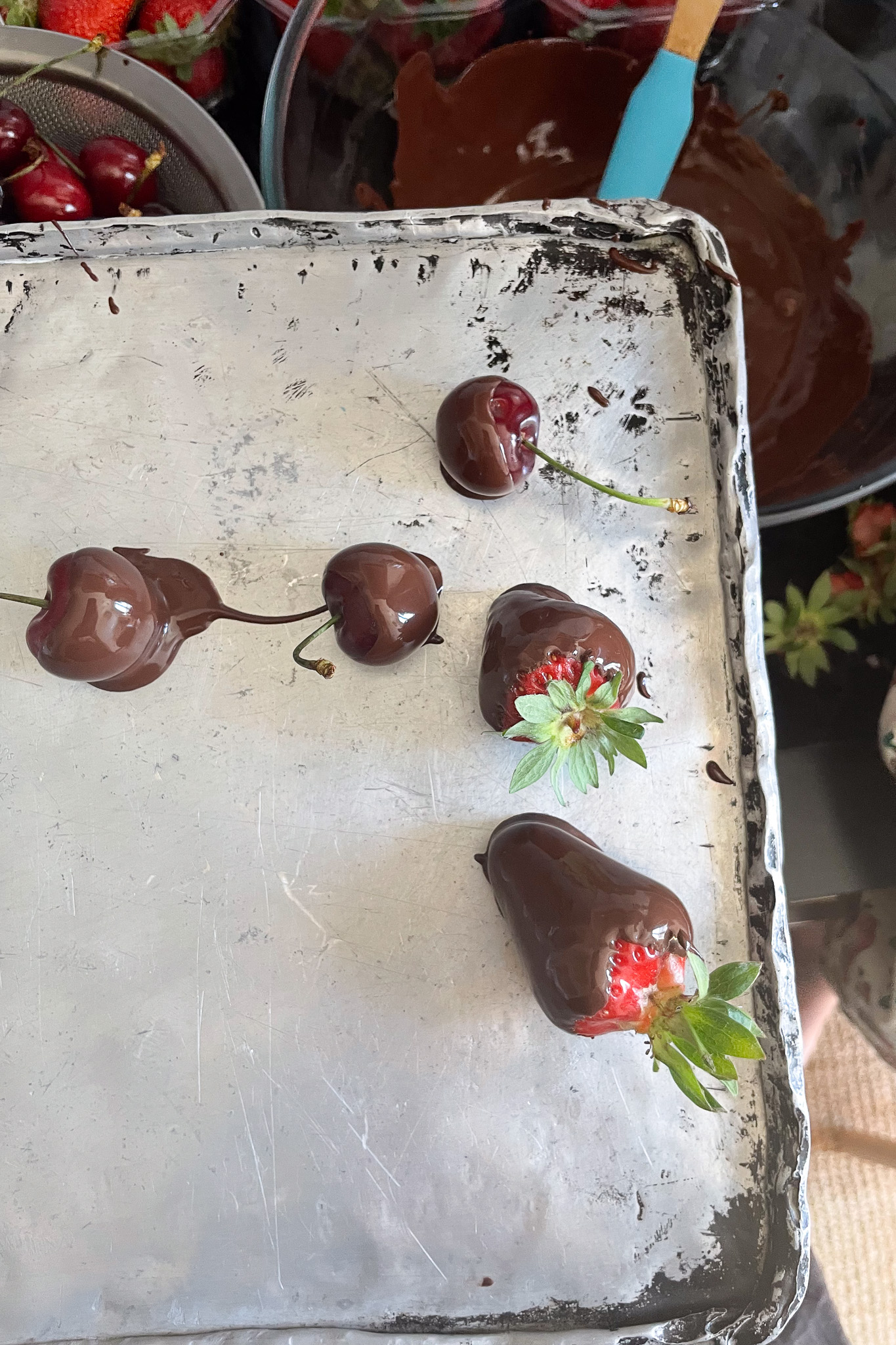 Let them place the fruit on the tray with some guidance.
