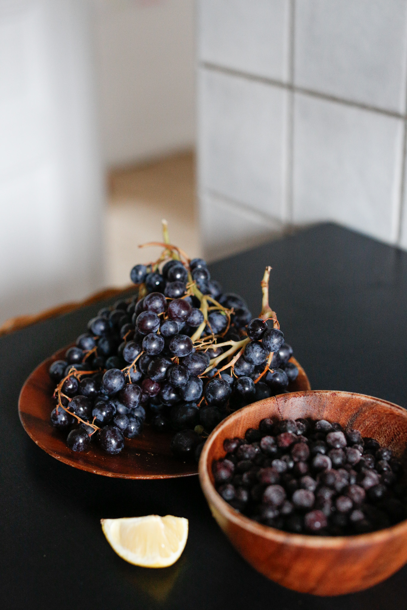 Gather your ingredients. Muscat grapes, frozen blueberries and fresh lemon.