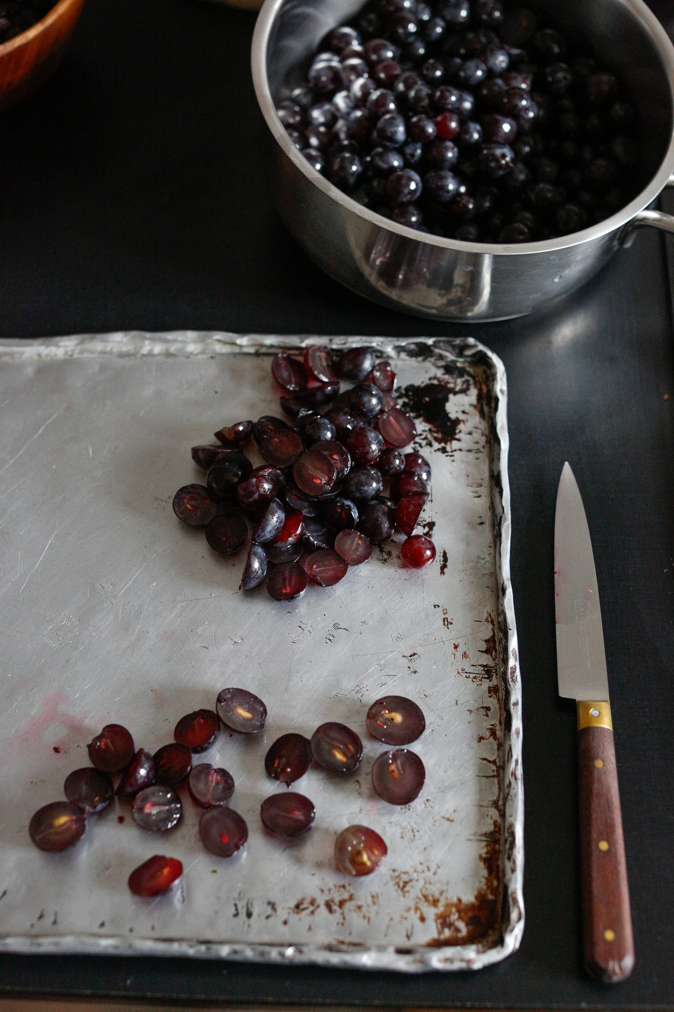 As usual I like to work in groupings. I'll cut in half a group of grapes and then extract the seeds all at once. Repeat until your pile is finished.